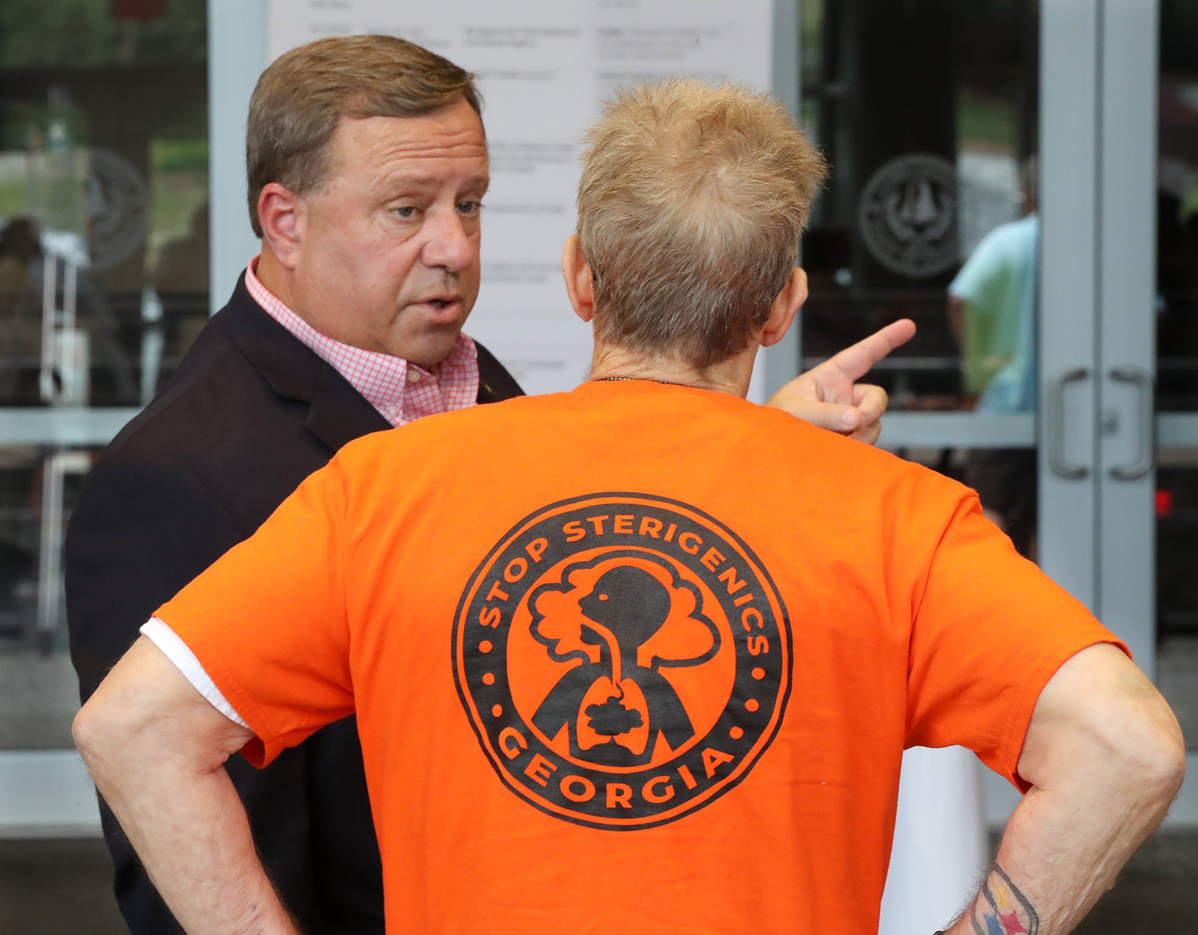 August 19, 2019 Marietta: Cobb Commissioner Bob Ott speaks with Stop Sterigenics Georgia volunteer Barry Goppman as Cobb officials and environmental regulators hold a town hall and community forum in the wake of reports that Cobb and Fulton have high levels of carcinogenic gas on Monday, August 19, 2019, in Marietta. A user and emitter of the gas, Sterigenics, which sterilizes medical equipment, operates in the area. Curtis Compton/ccompton@ajc.com