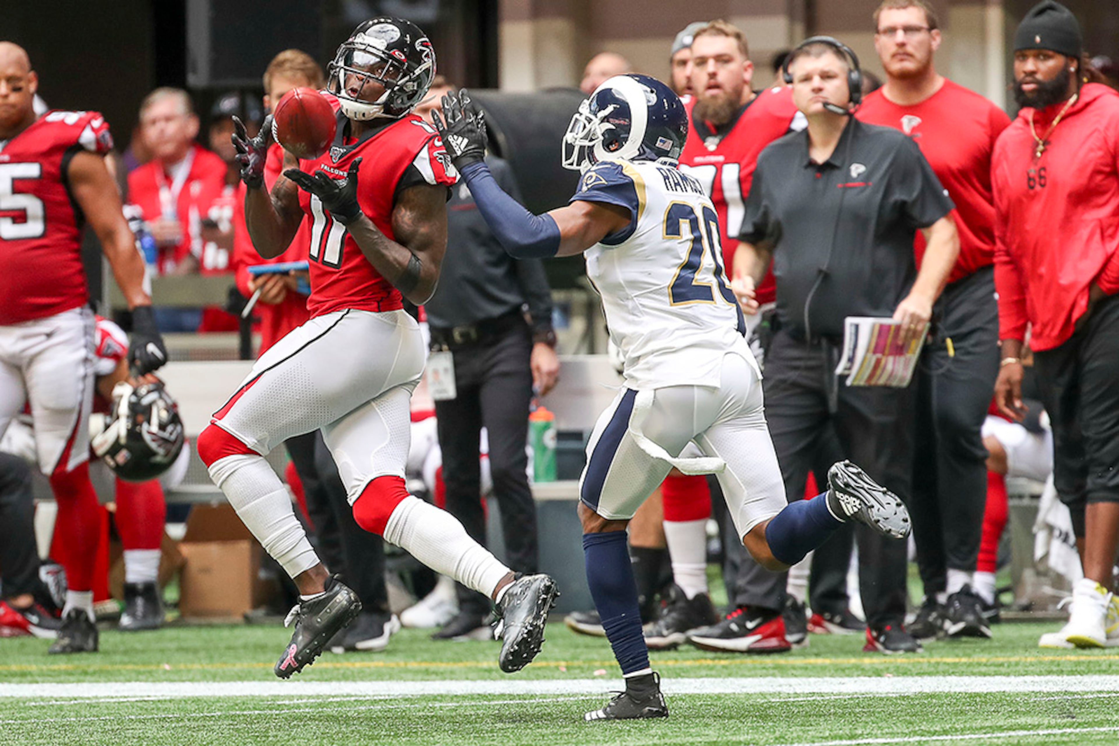 Falcons wide receiver Julio Jones (11) hauls in a catch on the sidelines during the first half of the game against the Los Angeles Rams Sunday, Oct. 20, 2019, at Mercedes-Benz Stadium in Atlanta.