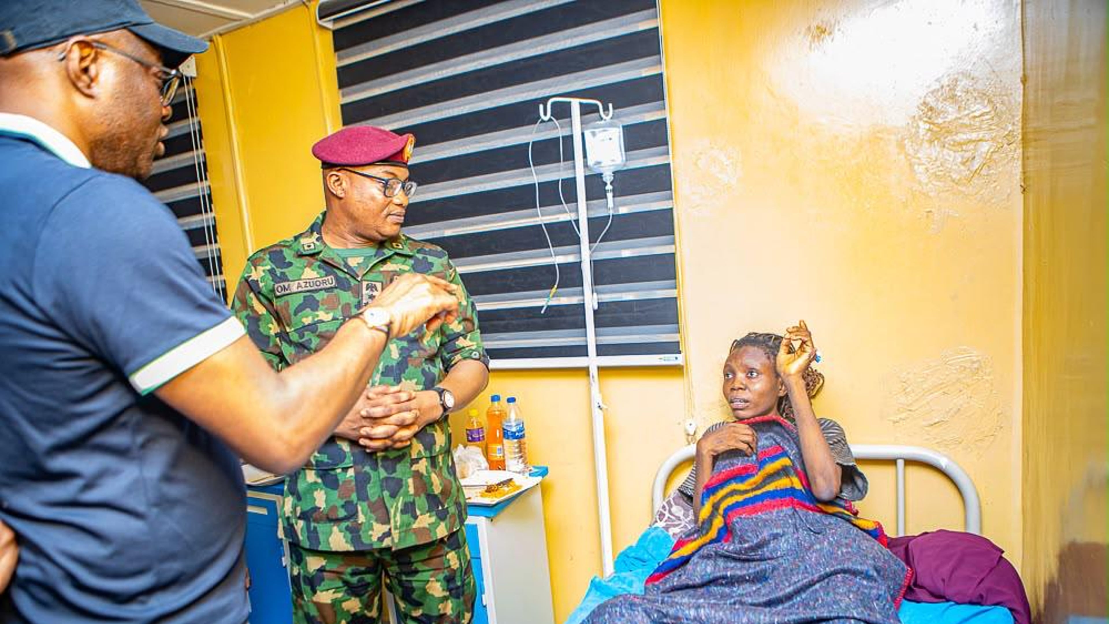 In this photo released by Oyo state government House, Governor Seyi Makinde, left, visits a teacher abducted in May by Islamic militants, following her release at a hospital in southwestern Oyo, Nigeria, Saturday, July 11, 2026. (Oyo State government House via AP)