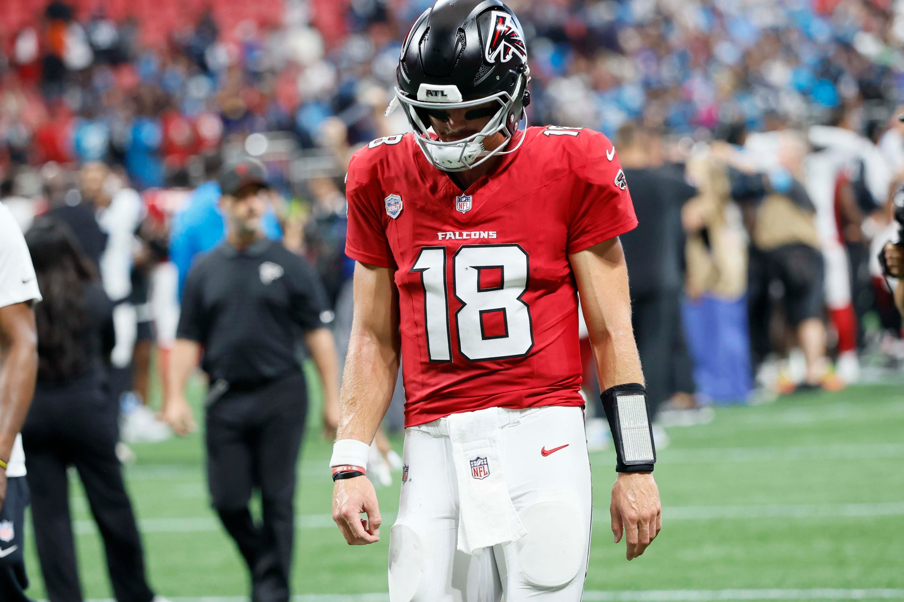 Atlanta Falcons quarterback Jack Strand (18) leaves the field following the Falcons’ 34-3 loss to the Carolina Panthers at Mercedes-Benz Stadium in Atlanta on Sunday, Sept. 20, 2026. (Miguel Martinez/AJC)