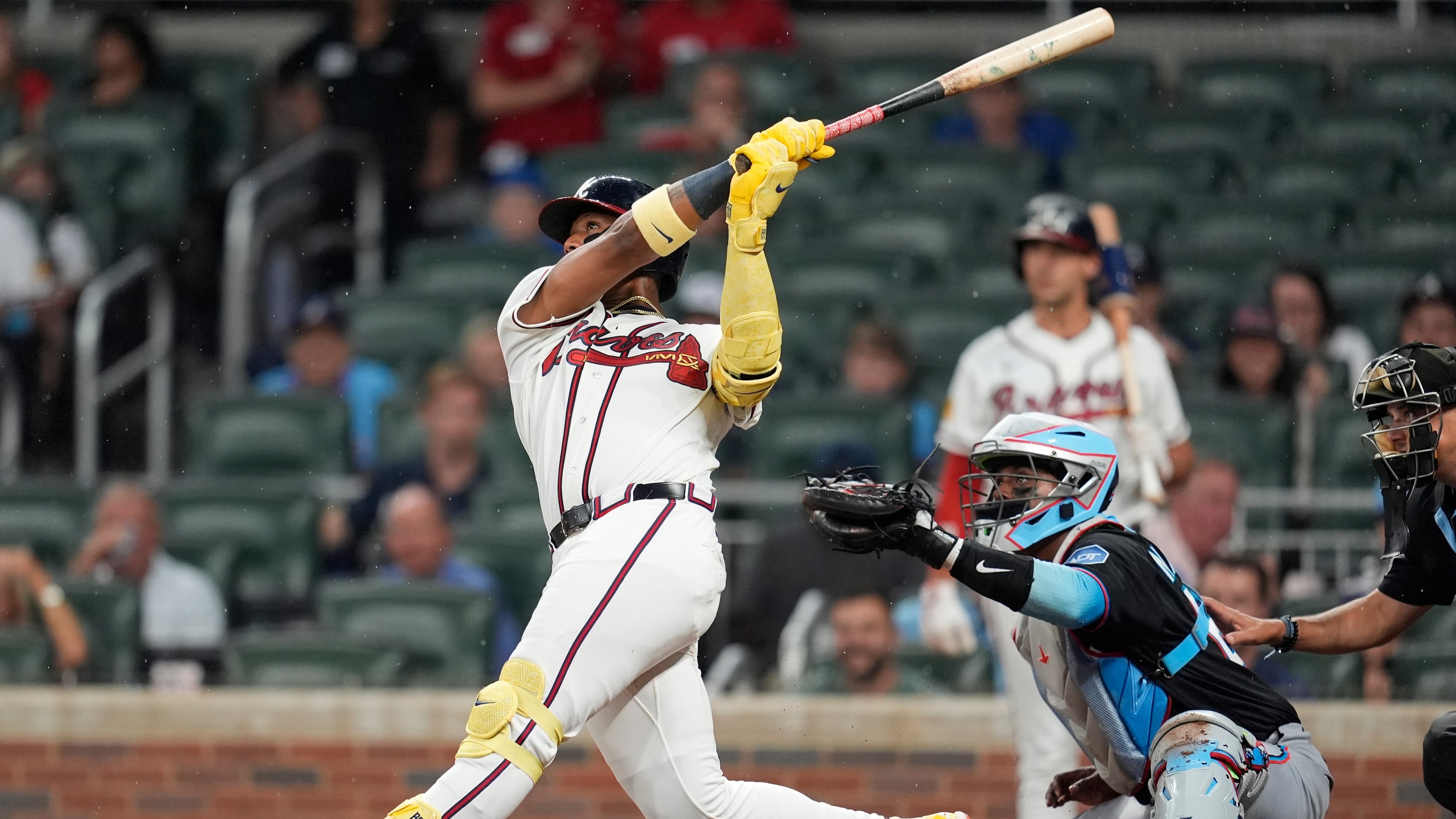 Atlanta Braves' Ronald Acuña Jr. (13) hits a two-run homer against the Miami Marlins in the third inning of a baseball game, Thursday, Aug. 6, 2026, in Atlanta. (AP Photo/Mike Stewart)