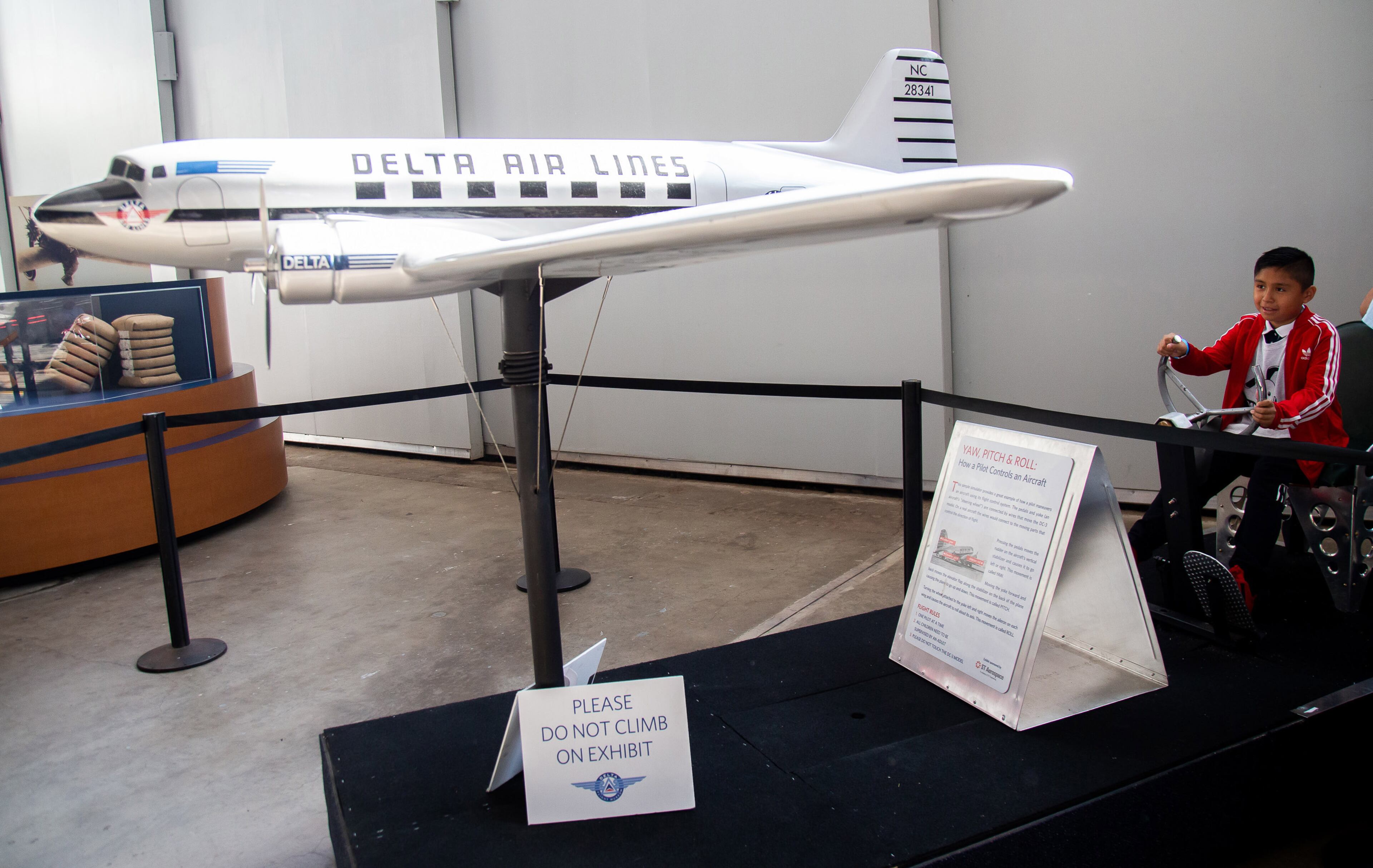 Harold Vicente, 9, flys a flight simulator during the Jane Goodall Institute's Roots & Shoots Celebration of Compassion, Action & Peace event at the Delta Flight Museum on Saturday, September 21, 2019. STEVE SCHAEFER / SPECIAL TO THE AJC