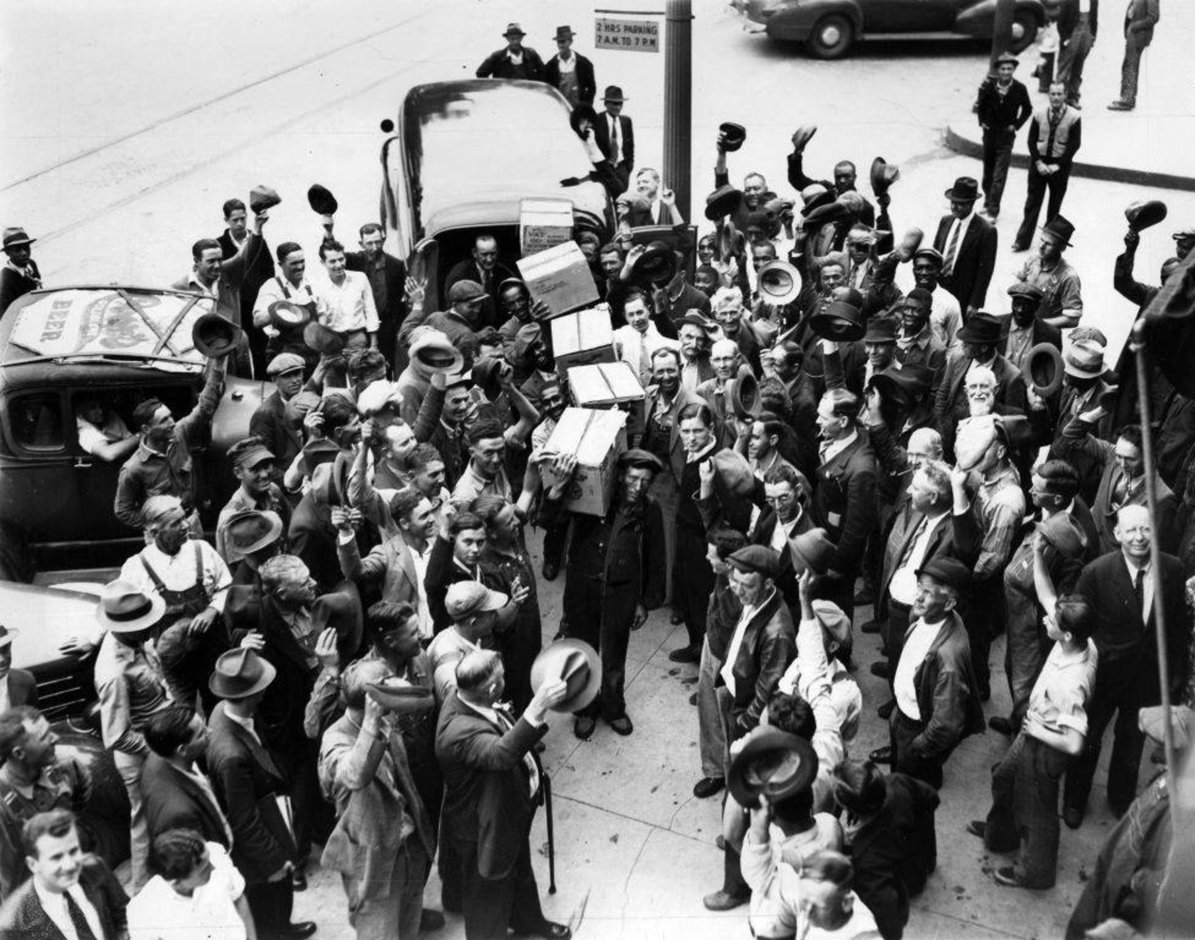 From original caption, published April 22, 1938:"Following the 'land office business' from Atlantians and Mariettians Thursday evening, the second Smyrna liquor store was crowded Friday morning by local residents. H. M. Lively, manager, is delivering 'the goods' as Bill Spence signs the book."