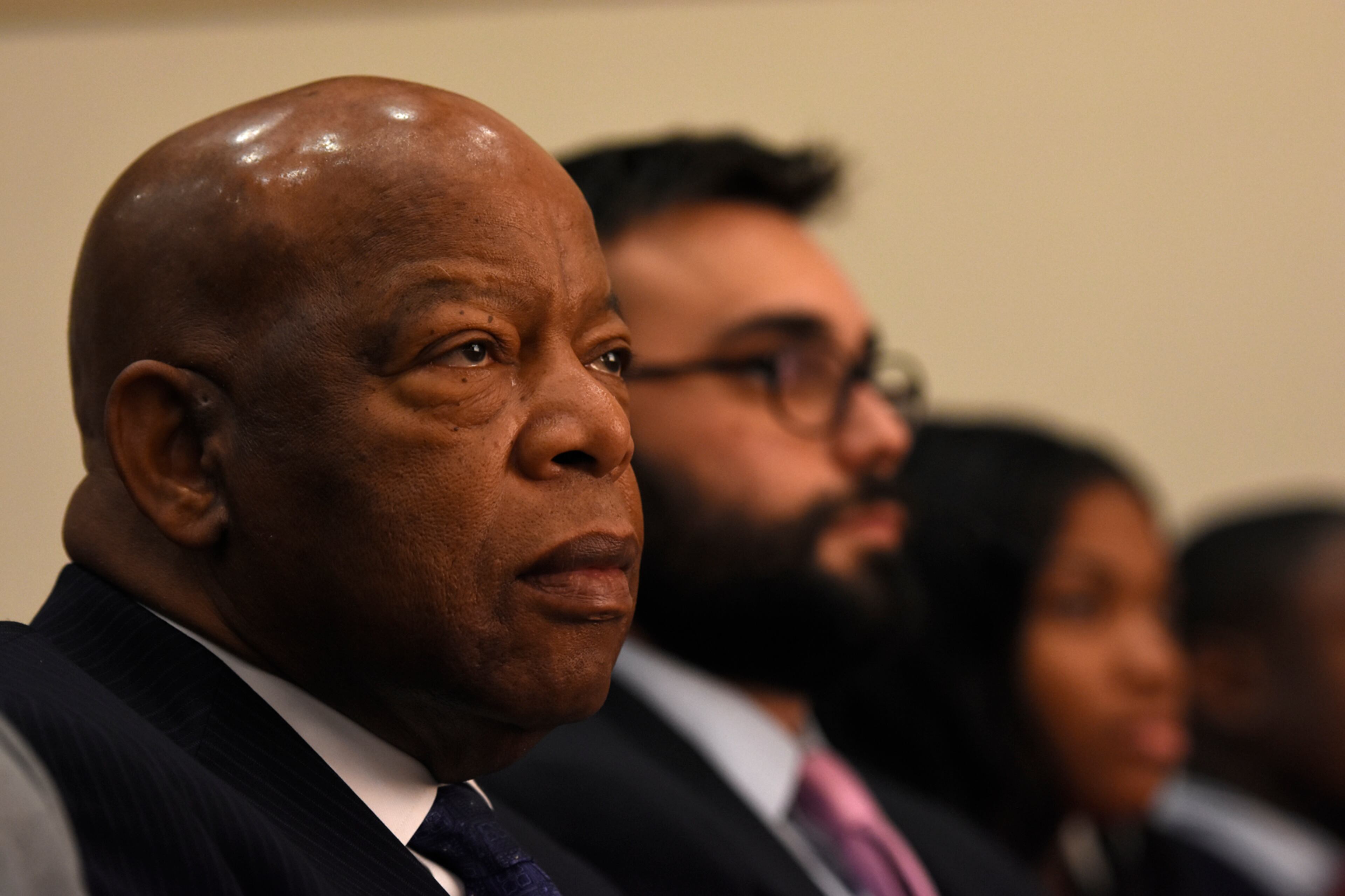 October 24, 2016, Atlanta - Congressman John Lewis, left, listens to speakers with author Andrew Aydin, center, during the Secondary English/Language Arts Fall Symposium at Martin Luther King, Jr. Middle School in Atlanta, on Monday, October 24, 2016. Lewis and Aydin collaborated on a graphic novel about Lewis' life. (DAVID BARNES / DAVID.BARNES@AJC.COM)
