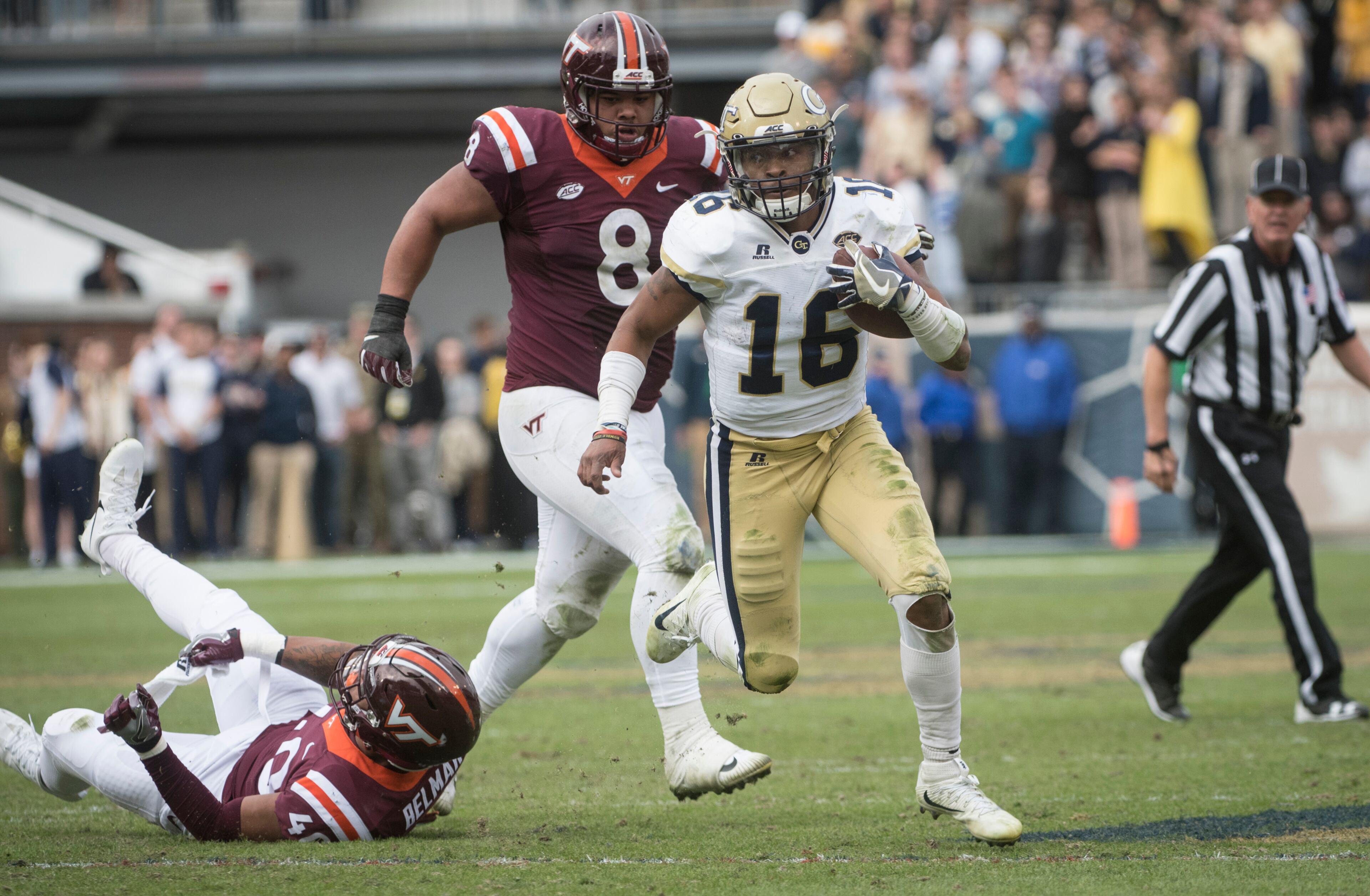 Georgia Tech quarterback TaQuon Marshall (16) runs leaving Virginia Tech defensive end Emmanuel Belmar (40) in the grass and defensive tackle Ricky Walker (8) giving chase during the second half of a football game on Saturday, Nov.11, 2017, in Atlanta. (Photo/John Amis)