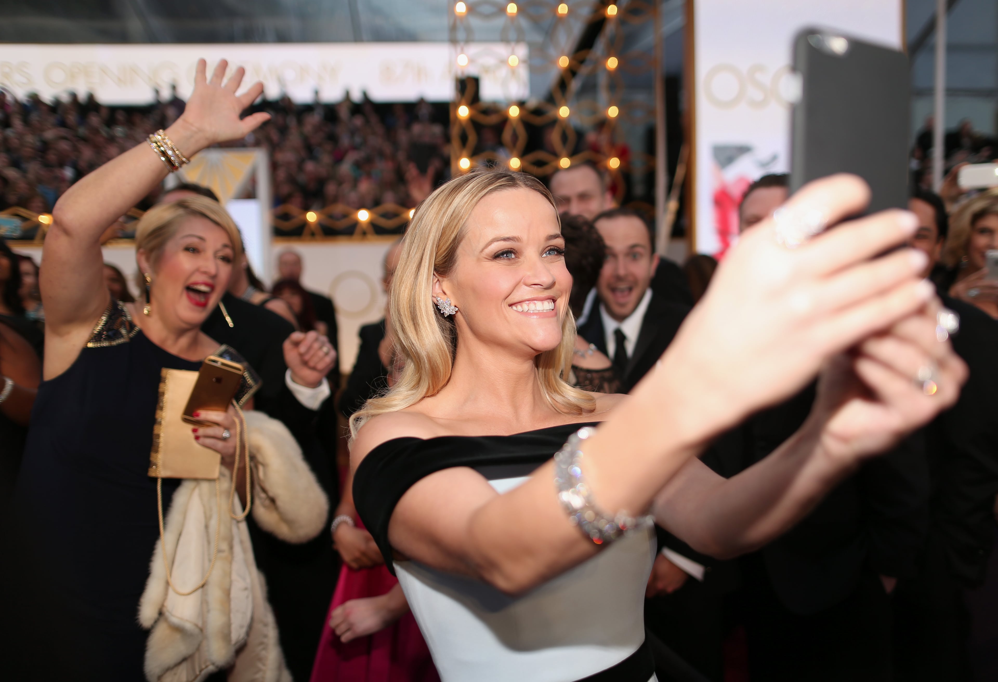 HOLLYWOOD, CA - FEBRUARY 22: Actress Reese Witherspoon takes a selfie at the 87th Annual Academy Awards at Hollywood & Highland Center on February 22, 2015 in Hollywood, California. (Photo by Christopher Polk/Getty Images)