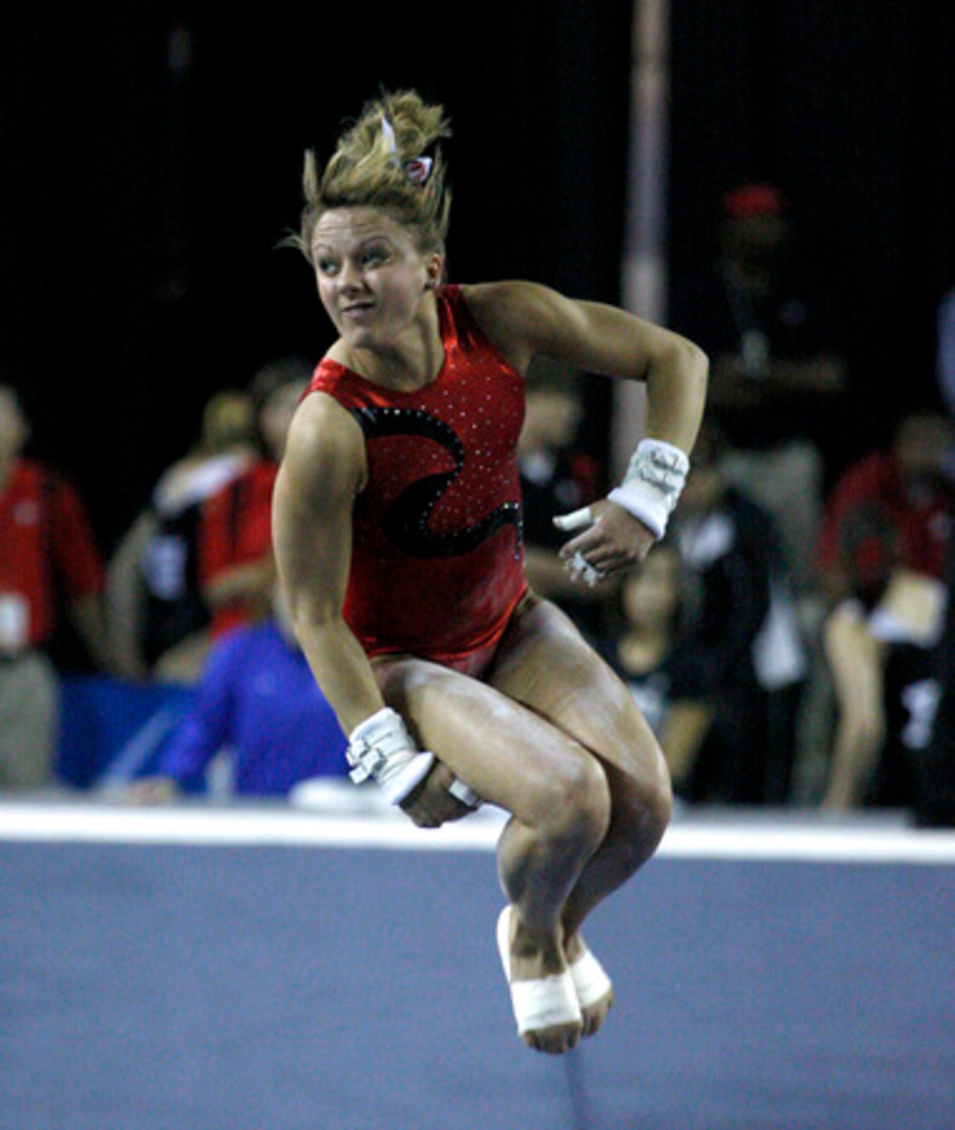 Freshman Cassidy McComb flies through the air as she exits the beam. The Gym Dogs sealed their fourth straight NCAA title with strong performances on the balance beam.