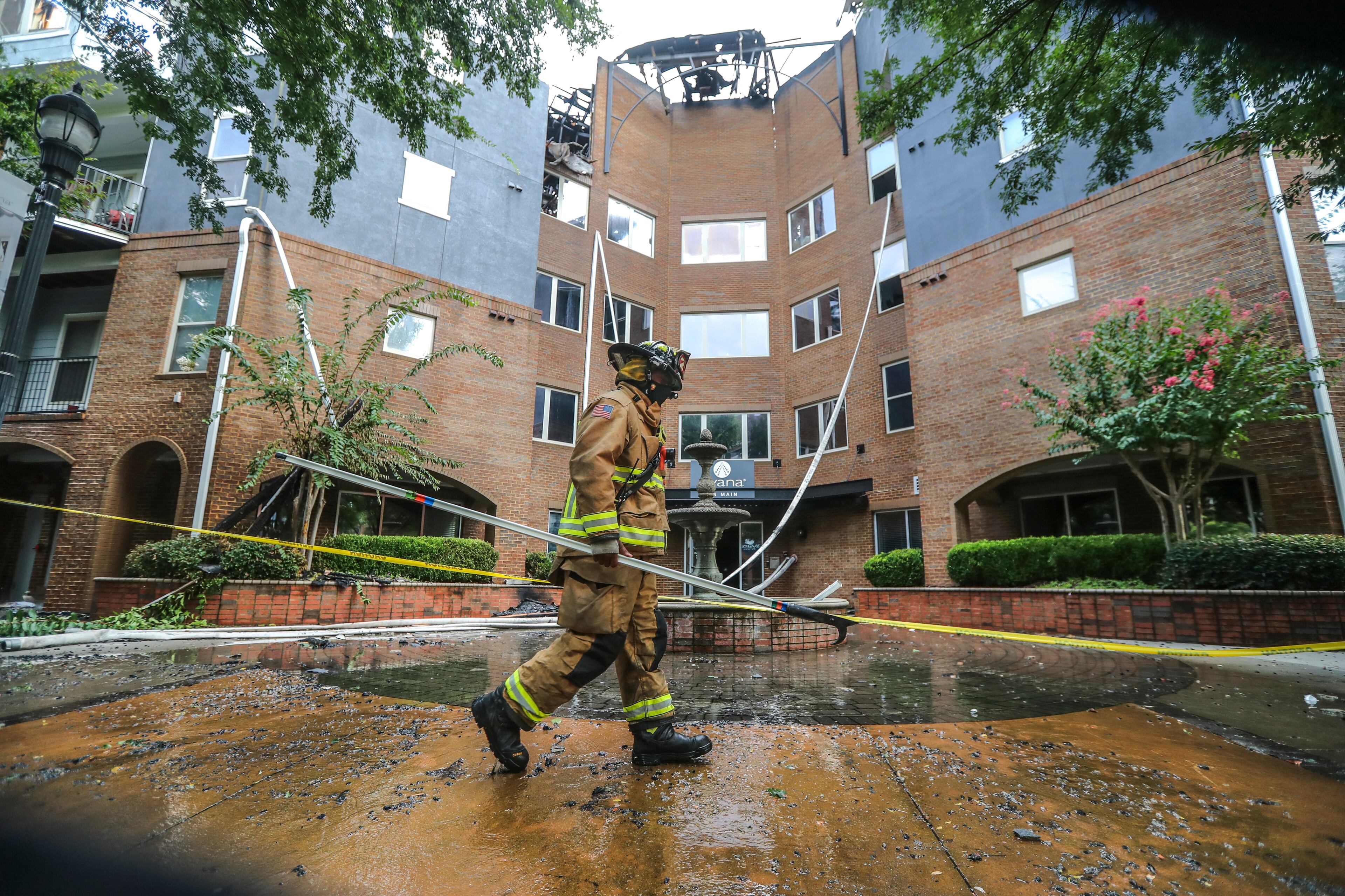August 20, 2020 Atlanta: Atlanta firefighters remained on the fire scene Thursday, Aug. 20, 2020 where the number of people displaced by Wednesday’s massive apartment fire in Buckhead grew, the American Red Cross said Thursday. According to spokeswoman Sherry Nicholson, at least 182 people from 104 families were impacted by the blaze at the Avana on Main, up from Wednesday’s count of 162 people from 101 families. Those numbers, she said, could continue to rise. “Some people don’t want our help right away, or feel that they don’t need it,” Nicholson told AJC.com Thursday morning. “And, obviously, they are not required to take it, but we try to assist as many families as we can.” Nearly 24 hours after flames tore through the four-story complex near the Lindbergh Center MARTA station, Atlanta firefighters remained on the scene to survey the damage and to determine what caused the blaze. The fire started about 12:30 p.m. Wednesday and then quickly ripped through the complex in the 500 block of Main Street, AJC.com previously reported. The blaze sent towers of thick, gray smoke up toward the sky. No residents were injured in the incident, but one firefighter was taken to the hospital about 3:30 p.m. after a wall collapsed near the parking deck. The firefighter injured his knee but is expected to recover. The last hot spots were not put out until after 6:30 a.m. Thursday, Channel 2 Action News reported. JOHN SPINK/JSPINK@AJC.COM