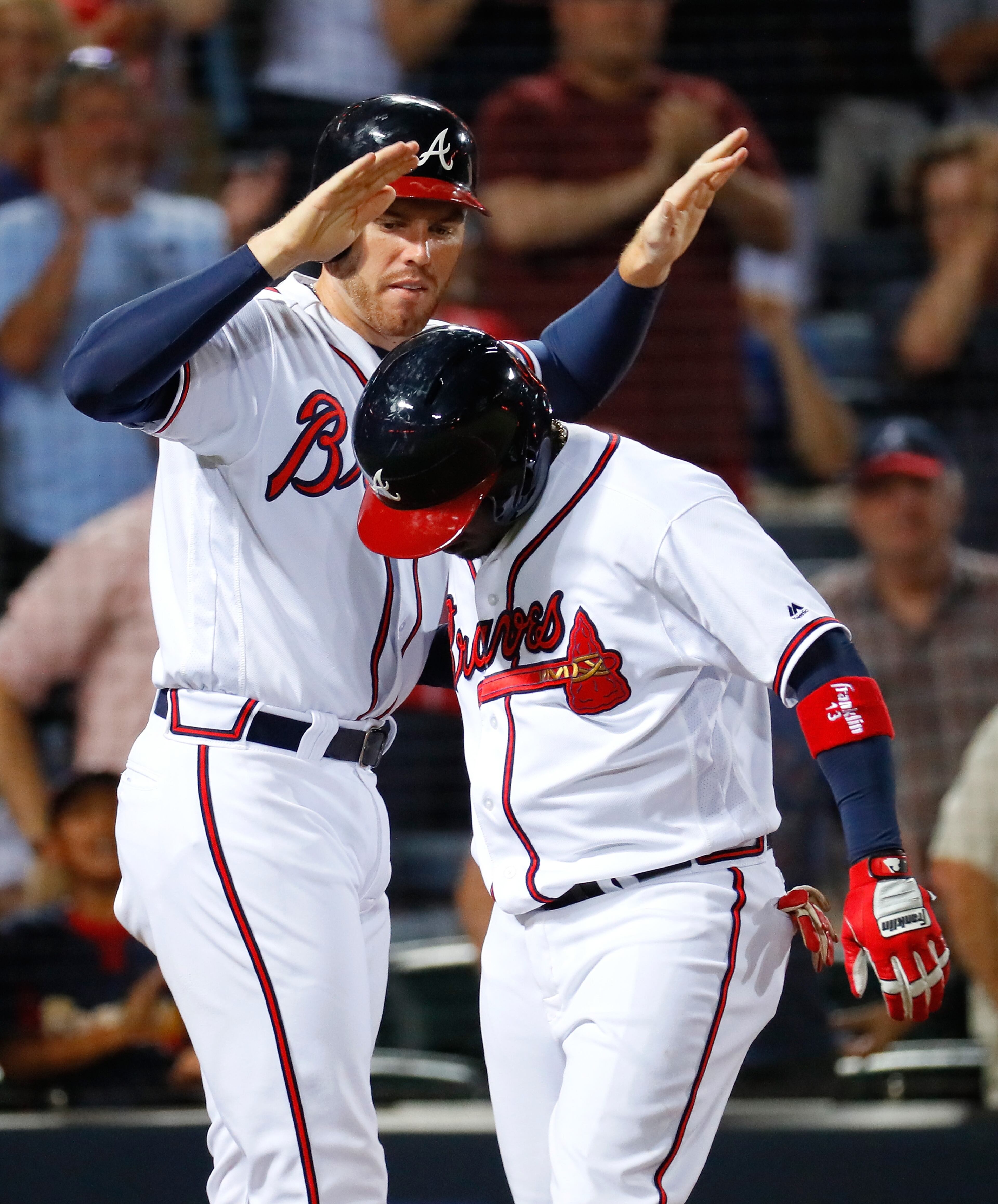 ATLANTA, GA - JUNE 23: Adonis Garcia #13 of the Atlanta Braves reacts after hitting a two-run homer to score Freddie Freeman #5 in the eighth inning against the New York Mets at Turner Field on June 23, 2016 in Atlanta, Georgia. (Photo by Kevin C. Cox/Getty Images)