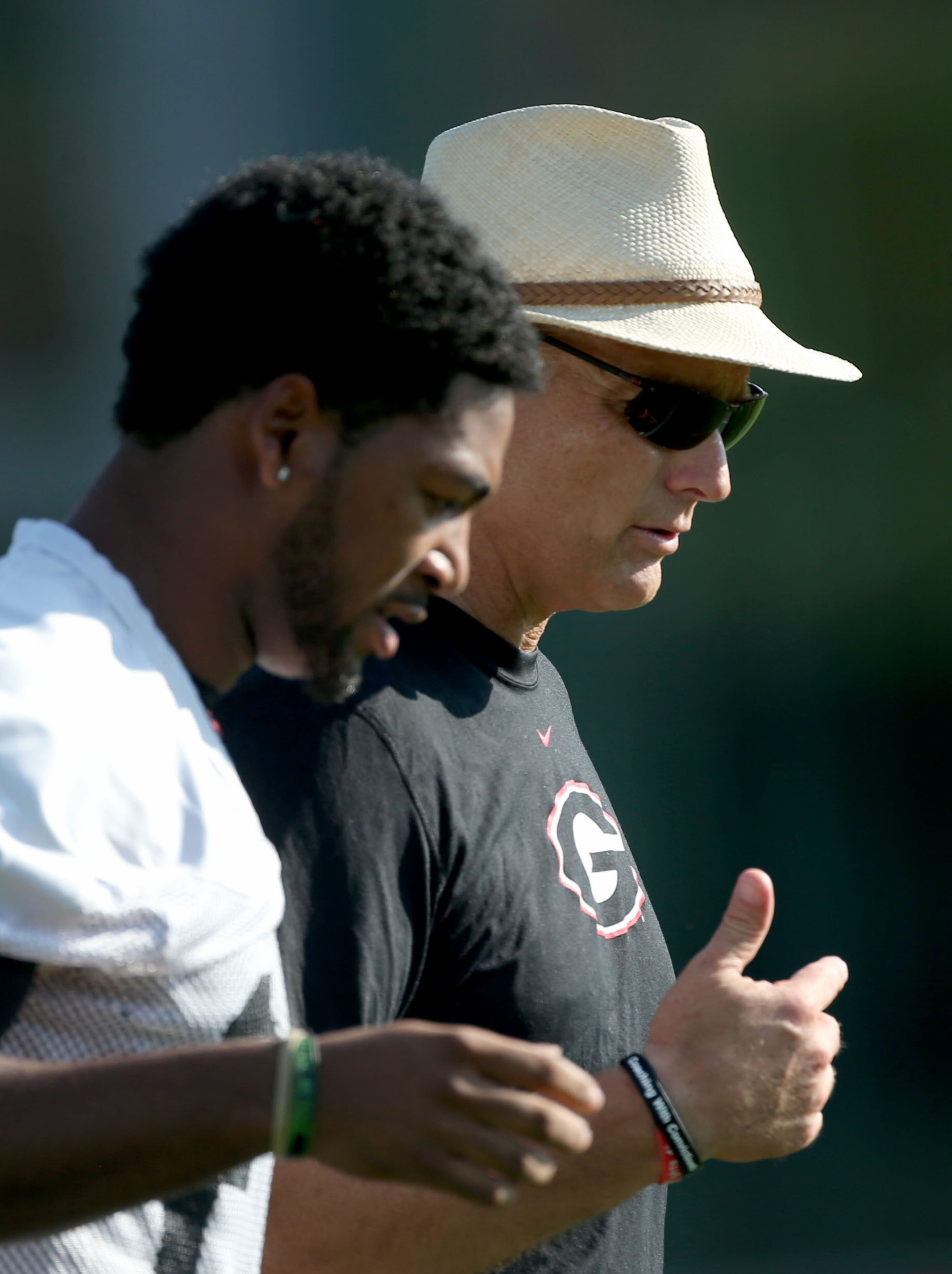 University of Georgia coach Mark Richt speaks with strong safety Marc Deas (23) during first day of practice at the University of Georgia Thursday afternoon in Athens, Ga., August 1, 2013. Coach Richt is entering his 13th season as head coach of the University of Georgia. JASON GETZ / JGETZ@AJC.COM