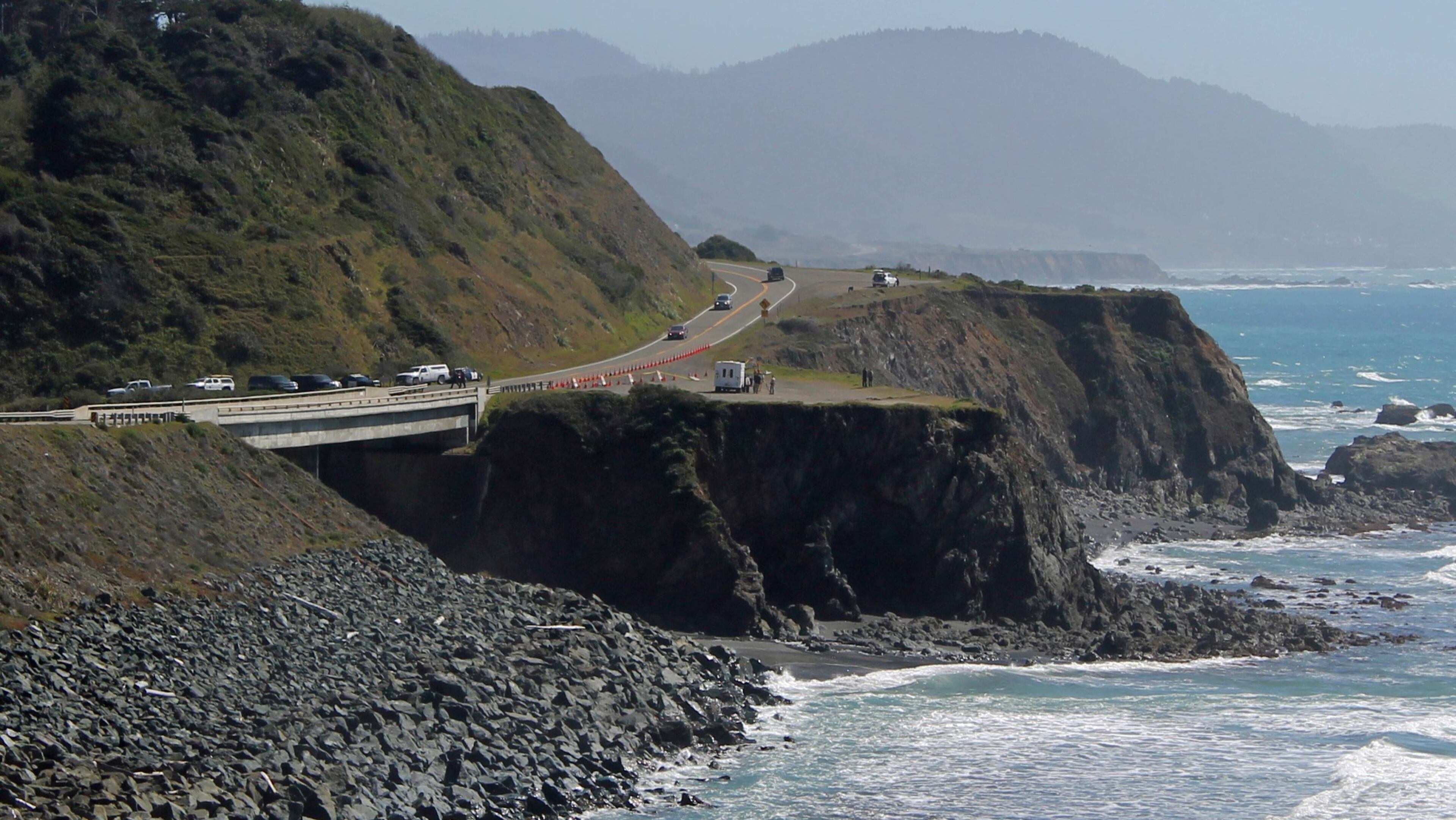 Investigators with the California Highway Patrol work at the scene where a couple and several of their children plunged in their SUV off Highway 1, Wednesday, March 28, 2018, near Fort Bragg, Calif. Searchers scoured the Northern California coast Wednesday for the missing children of a couple who were killed along with three of their other children when their SUV plunged off scenic Pacific Coast Highway onto rocks in the ocean.