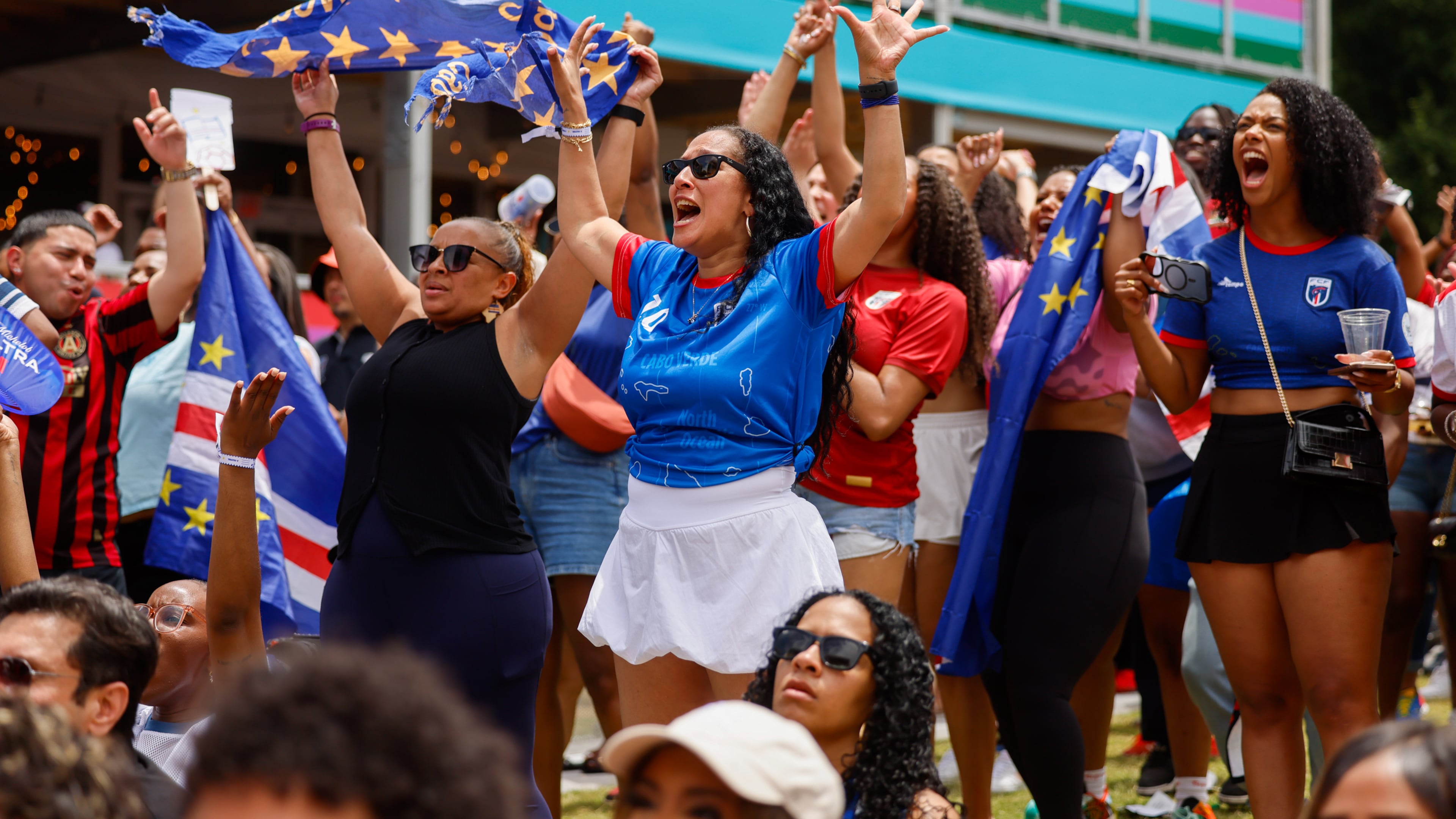 Cape Verde fans celebrate following a 0-0 draw at FIFA Fan Festival in Centennial Olympic Park during the Spain and Cape Verde match at the 2026 FIFA World Cup in Atlanta on June 15, 2026. It’s the first of eight World Cup matches to take place in Atlanta. It’s Cape Verde’s first World Cup. (Arvin Temkar/AJC)