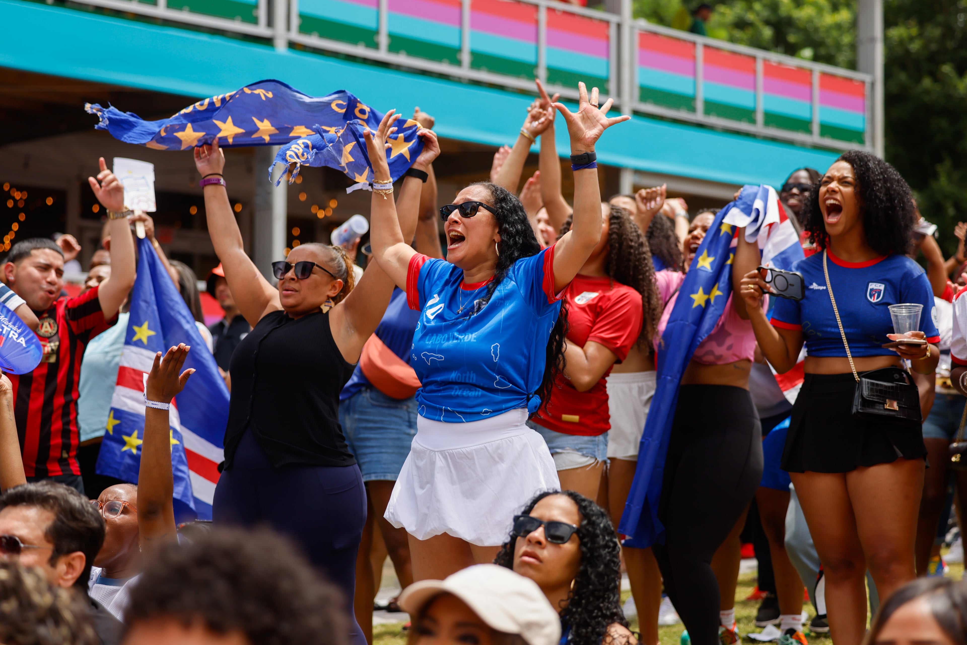 Cape Verde fans celebrate following a 0-0 draw at FIFA Fan Festival in Centennial Olympic Park during the Spain and Cape Verde match at the 2026 FIFA World Cup in Atlanta on June 15, 2026. It’s the first of eight World Cup matches to take place in Atlanta. It’s Cape Verde’s first World Cup. (Arvin Temkar/AJC)
