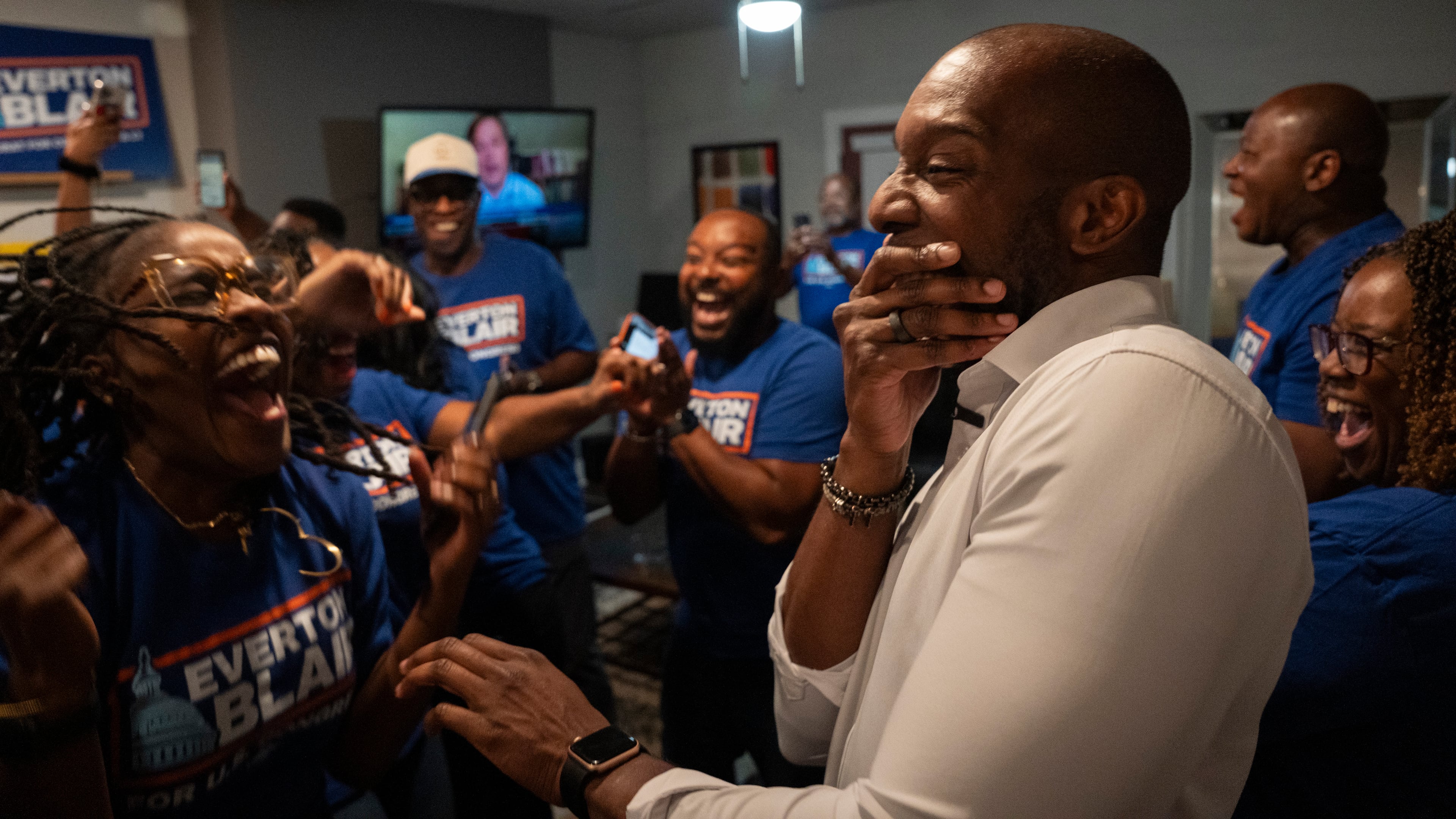 Friends, campaign staff and supporters scream with surprise and delight as former Gwinnett County School Board Chairman Everton Blair Jr. (right) celebrates winning the special election runoff for Georgia’s 13th Congressional District, defeating fellow Democrat Marcye Scott to succeed the late U.S. Rep. David Scott, in Lilburn, Ga., Tuesday, Aug. 25, 2026. (Olivia Bowdoin for the AJC)