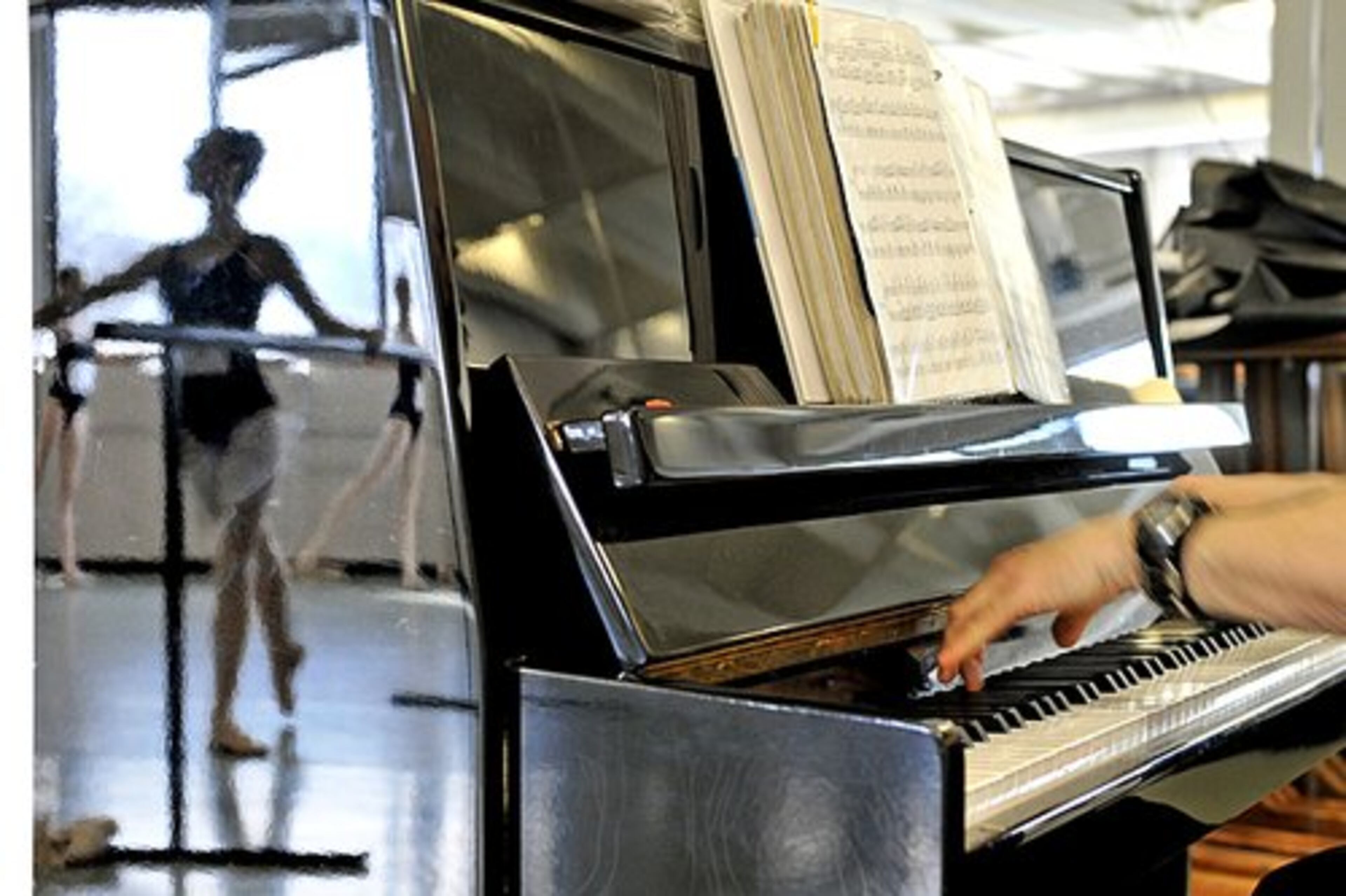 Aria Colangelo, 13, of Lawrenceville, is reflected in the piano of Alan J. Brown, during auditions.
