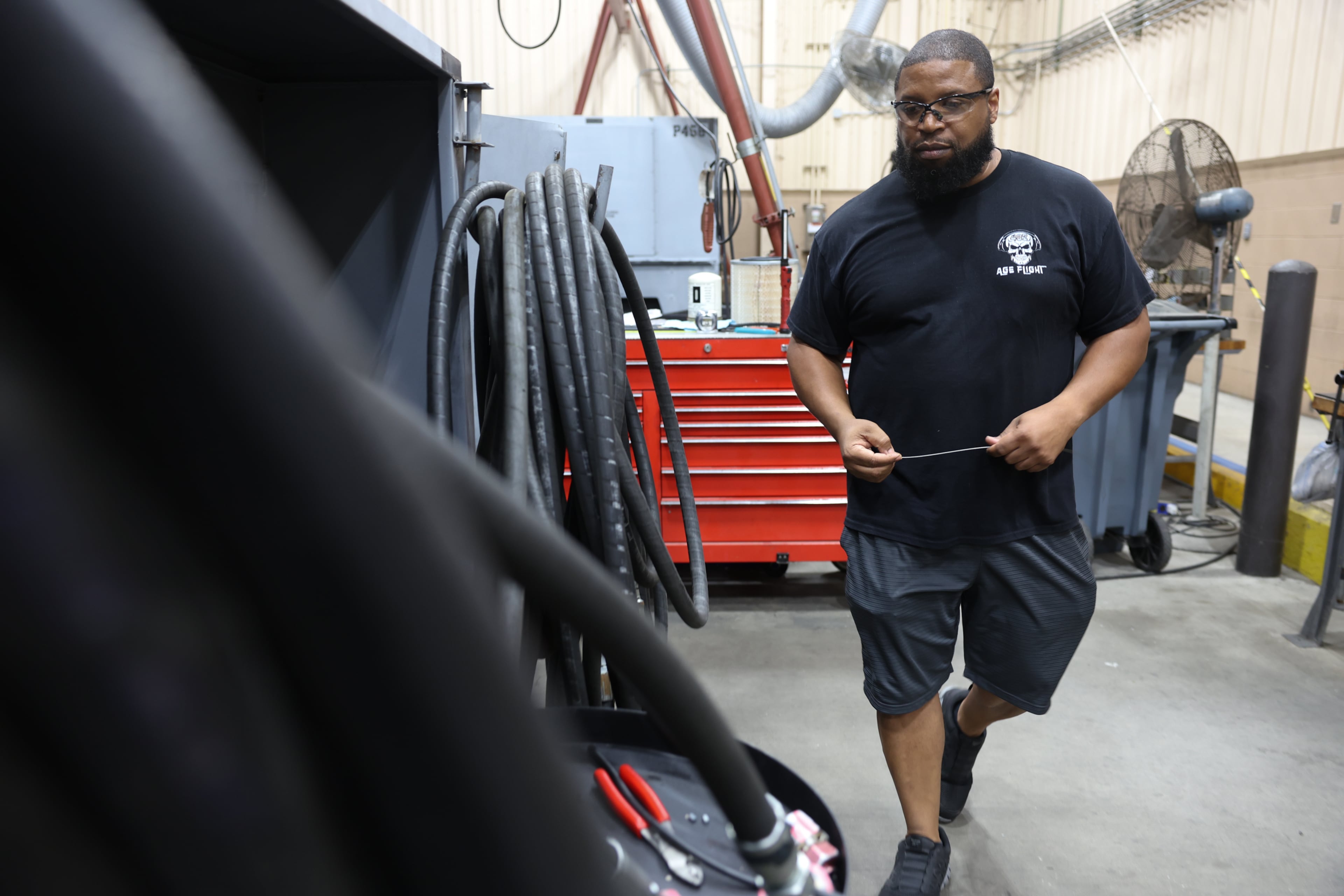 Powered support systems mechanic Isaiah Walker works in a shop at Robins Air Force Base on Friday, Aug. 21, 2026. (Arvin Temkar/AJC)
