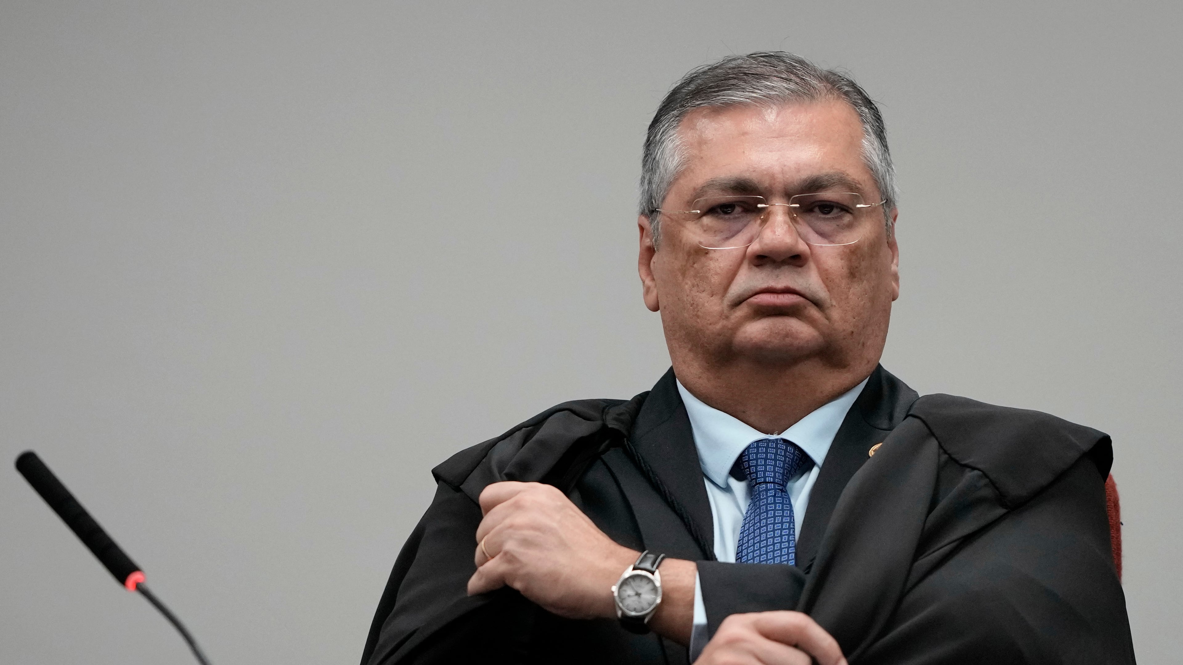 Justice Flavio Dino attends the trial of former Congressman Eduardo Bolsonaro at Brazil's Supreme Court in Brasilia, Tuesday, June 16, 2026. (AP Photo/Eraldo Peres)