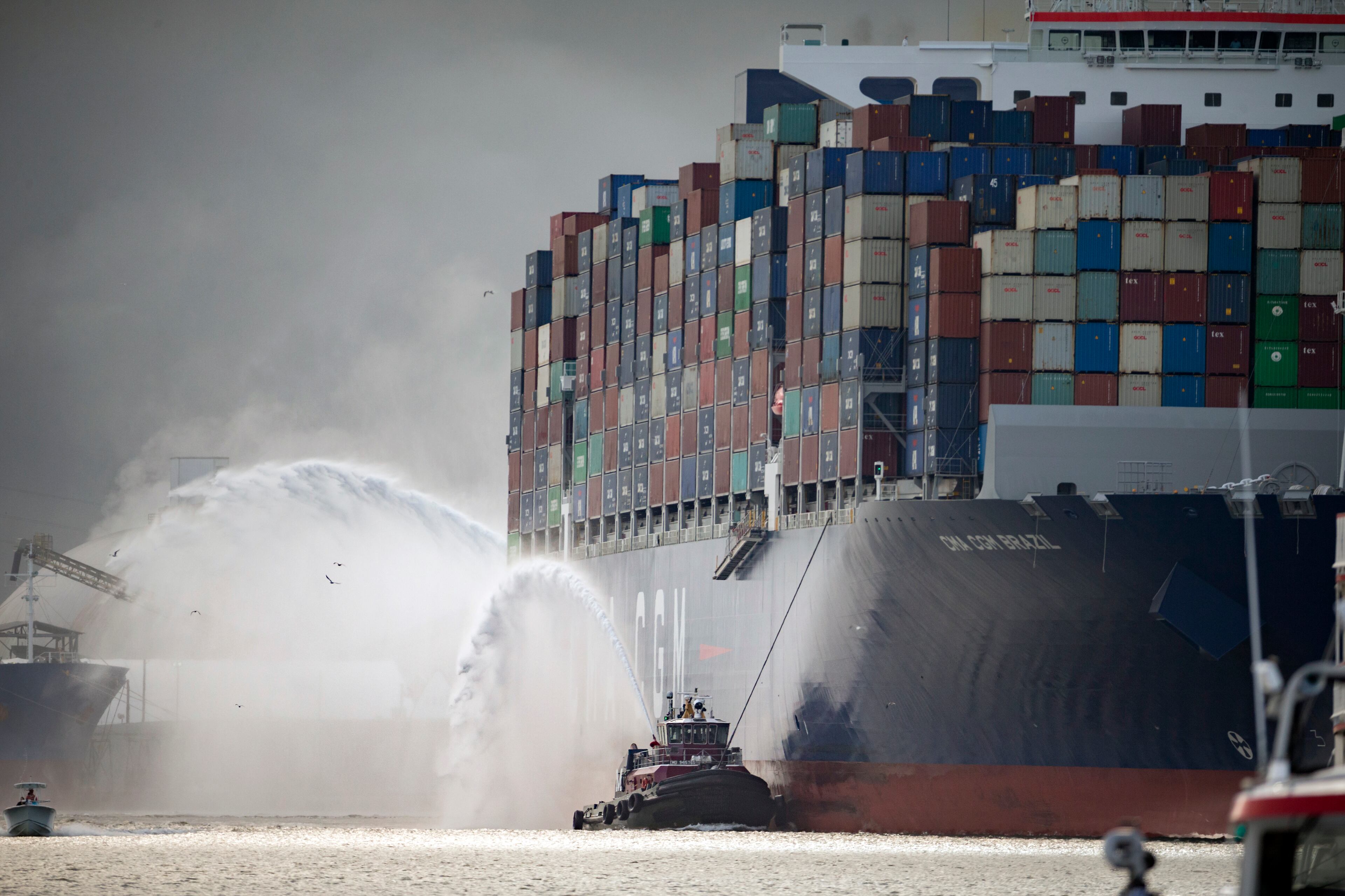 SAVANNAH, GA - SEPTEMBER 18, 2020: The Moran tugboat Laura K. Moran escorts the CMA CGM Brazil as it sails up the Savannah River to the Georgia Ports Authority's Garden City Terminal, Friday, Sept., 18, 2020, in Savannah, Ga. (AJC Photo/Stephen B. Morton)