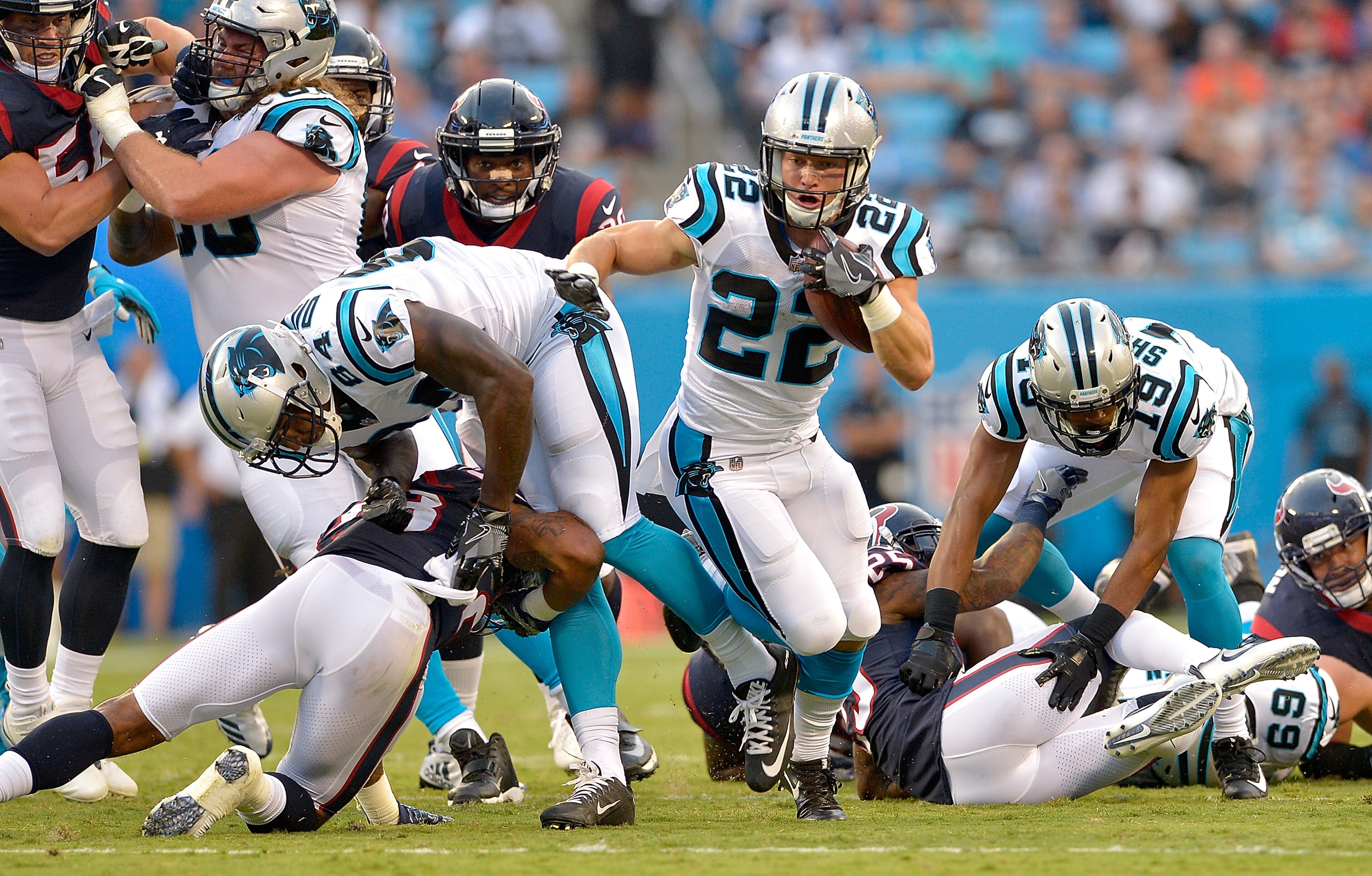CHARLOTTE, NC - AUGUST 09: Christian McCaffrey #22 of the Carolina Panthers runs against the Houston Texans during the preseason game at Bank of America Stadium on August 9, 2017 in Charlotte, North Carolina. (Photo by Grant Halverson/Getty Images)