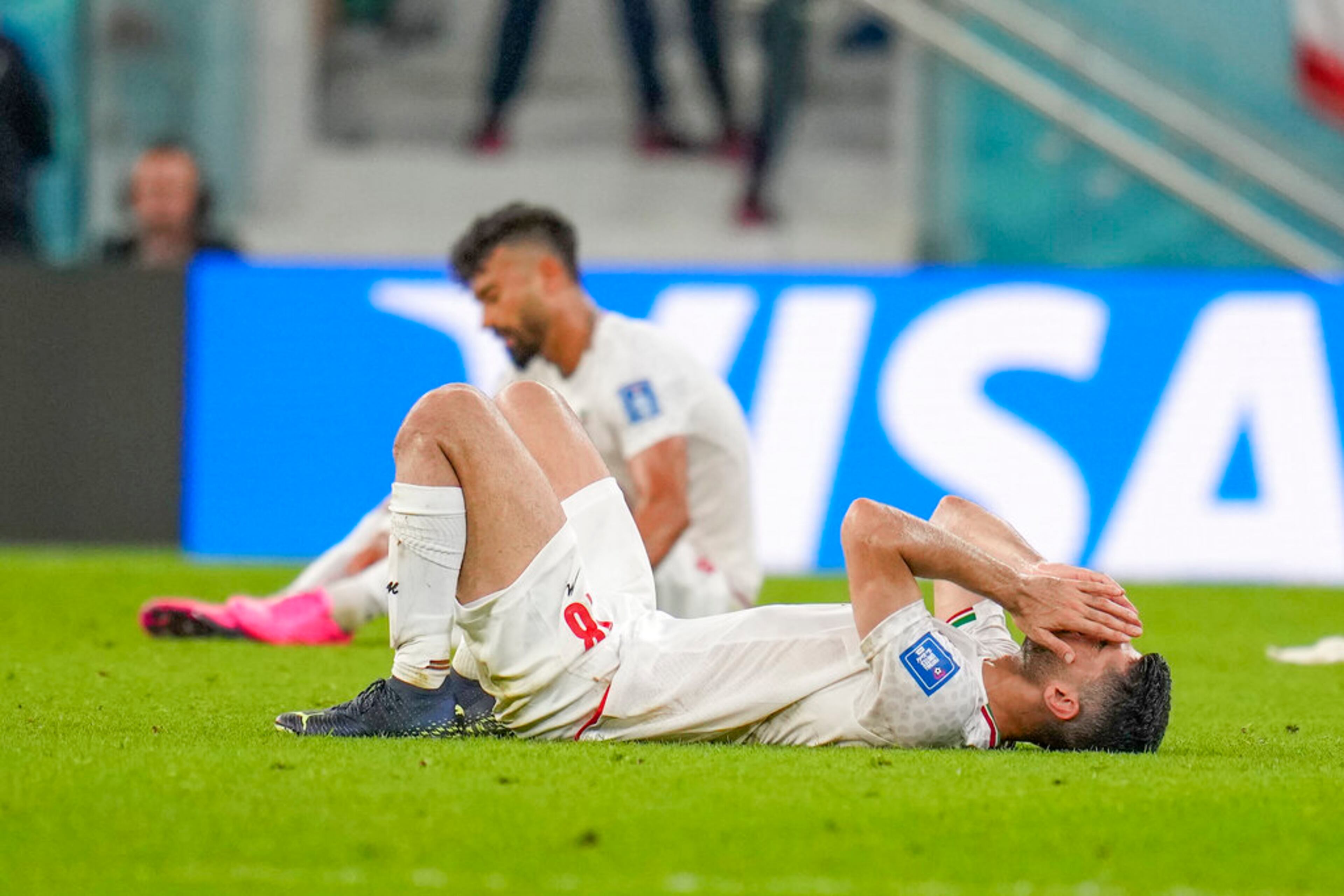 Iran's Ali Karimi is dejected after the World Cup group B soccer match between Iran and the United States at the Al Thumama Stadium in Doha, Qatar, Wednesday, Nov. 30, 2022. (AP Photo/Ricardo Mazalan)