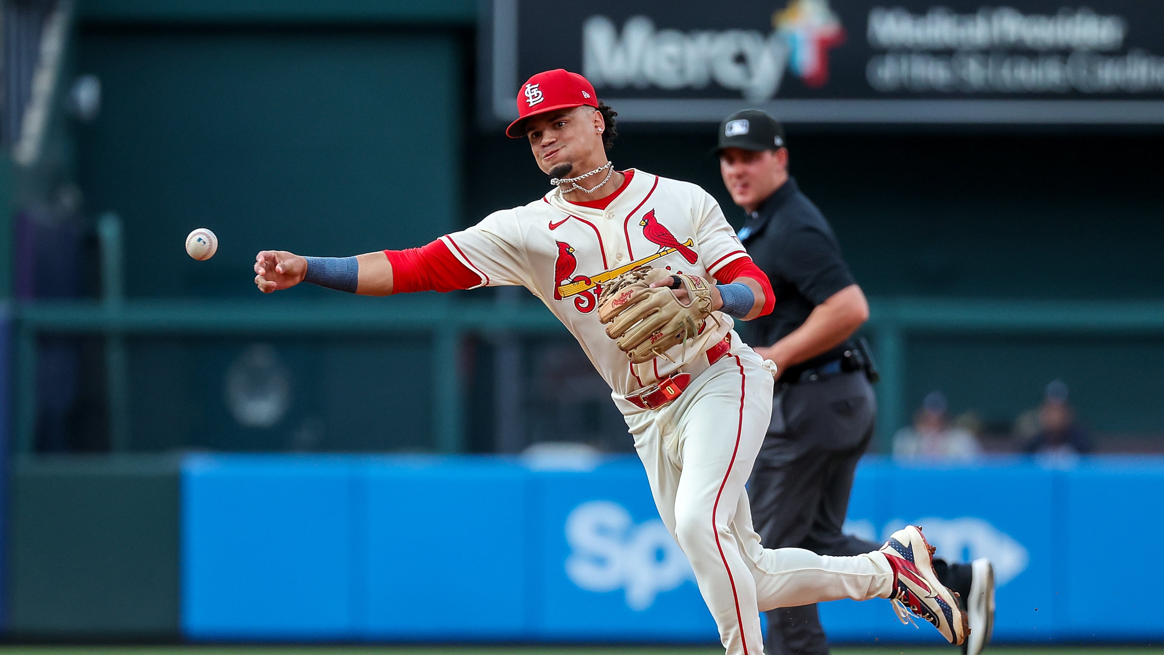 St. Louis Cardinals' Masyn Winn throws to first base for an out against Atlanta Braves' Michael Harris II during the third inning of a baseball game Saturday, July 11, 2026, in St. Louis. (AP Photo/Scott Kane)