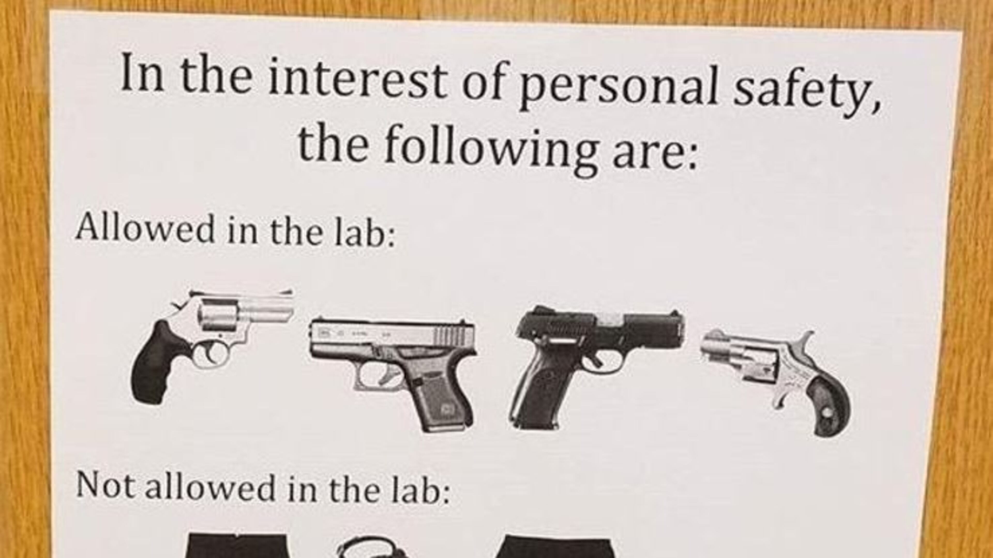 Someone posted this sardonic sign on the door to a lab at the University of Georgia earlier this year to mark the new campus carry law.