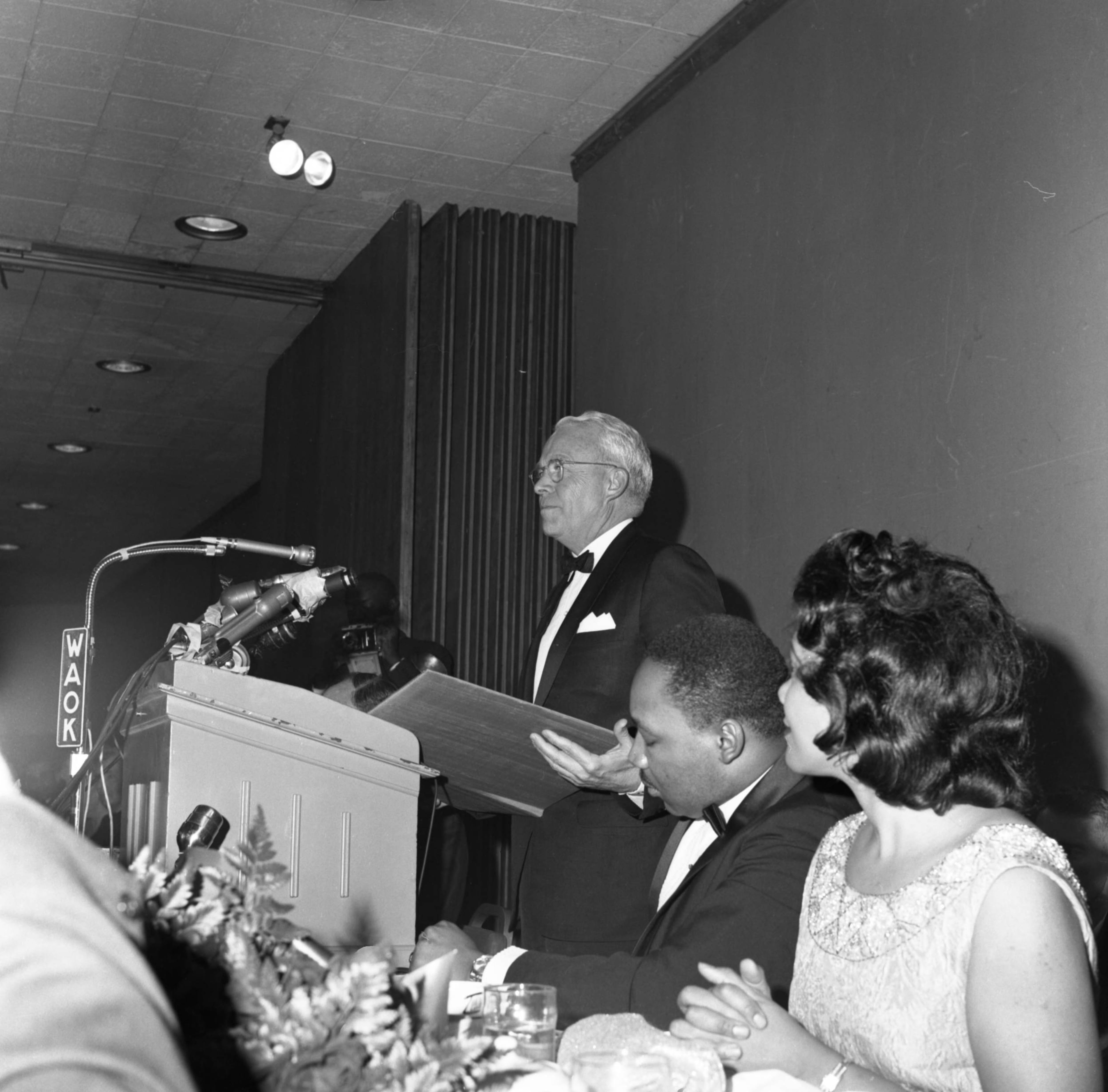 Martin Luther King, Jr. and Coretta Scott King listen to Atlanta Mayor Ivan Allen Jr. speak at King's Nobel Peace Prize recognition dinner, National Conference of Christians and Jews, Dinkler Plaza Hotel, Atlanta, Georgia, January 27, 1965. LBSCB12-120u, Lane Brothers Commercial Photographers Photographic Collection, 1920-1976. Special Collections and Archives, Georgia State University Library.
