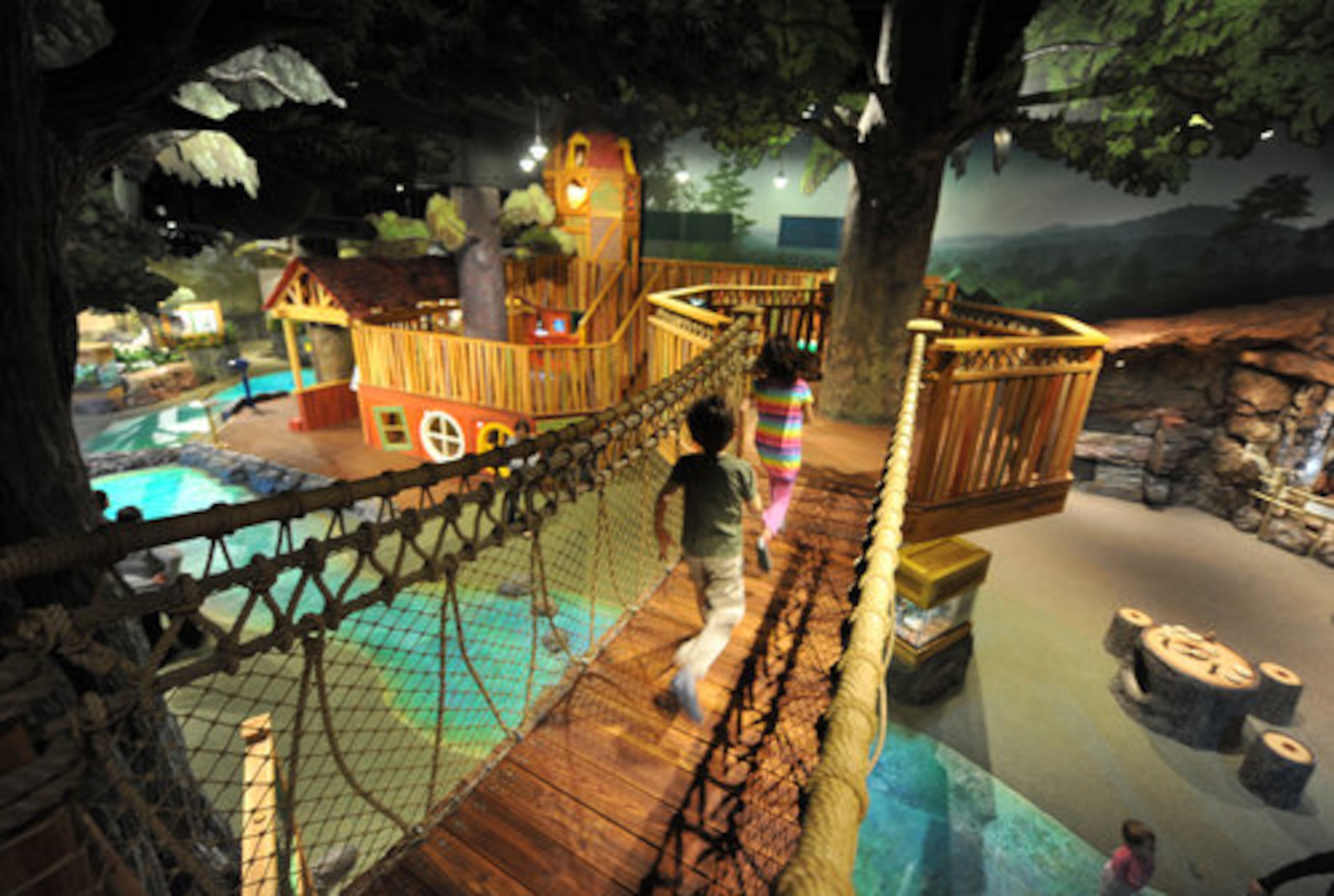 A rope bridge attaches a two-level clubhouse to a hollow tree that has been strung inside with netting ideal for climbing. The exhibit, designed in collaboration with the Thinkwell Group, a Burbank, Calif.-based development firm, is targeted toward ages 2-10.