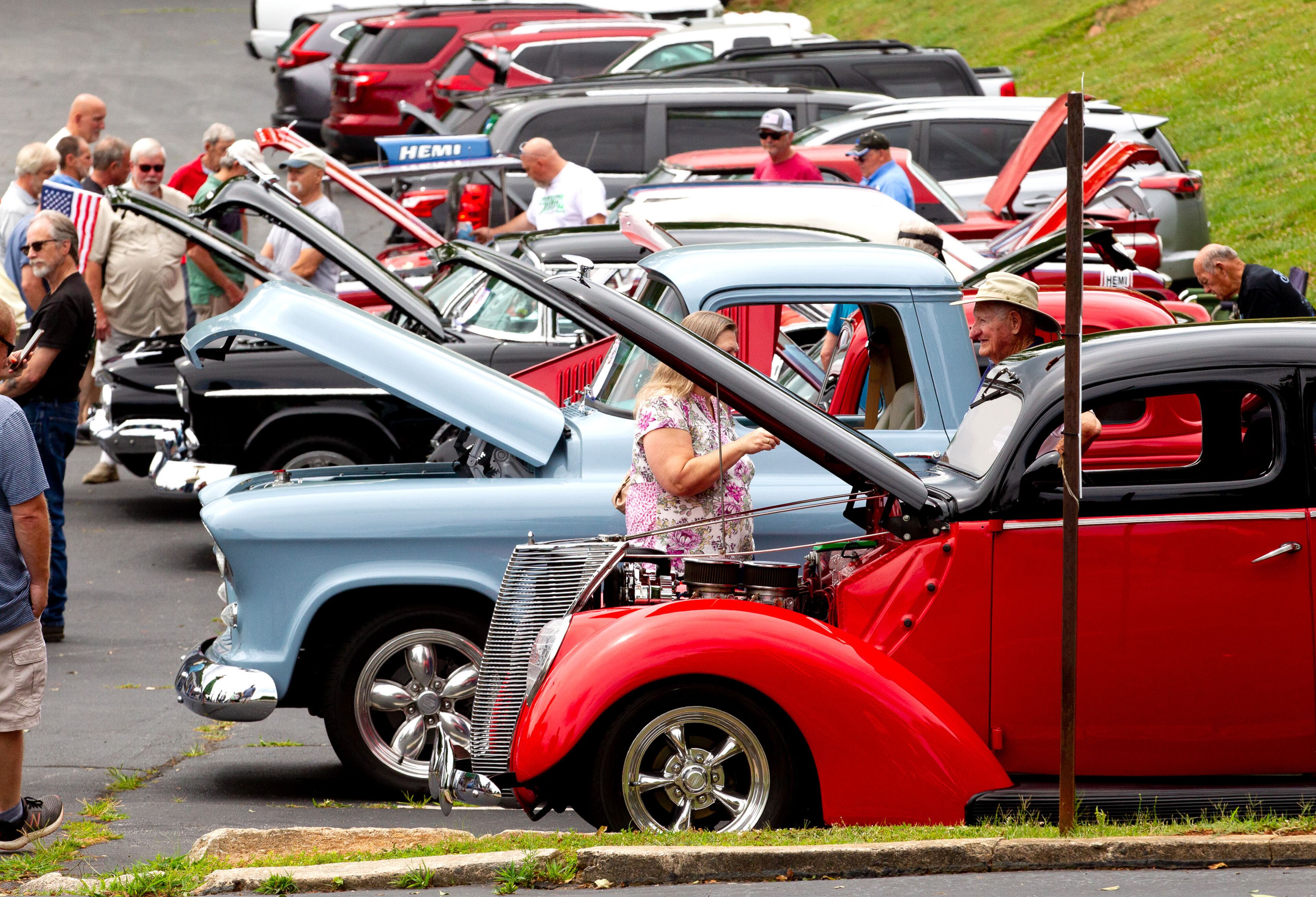 People wander around the cars at the Georgia Cool Cruisers car show in Tucker on Saturday, May 29, 2021. Entry fees for the show were used as donations to USO Georgia. (Photo: Steve Schaefer for The Atlanta Journal-Constitution)