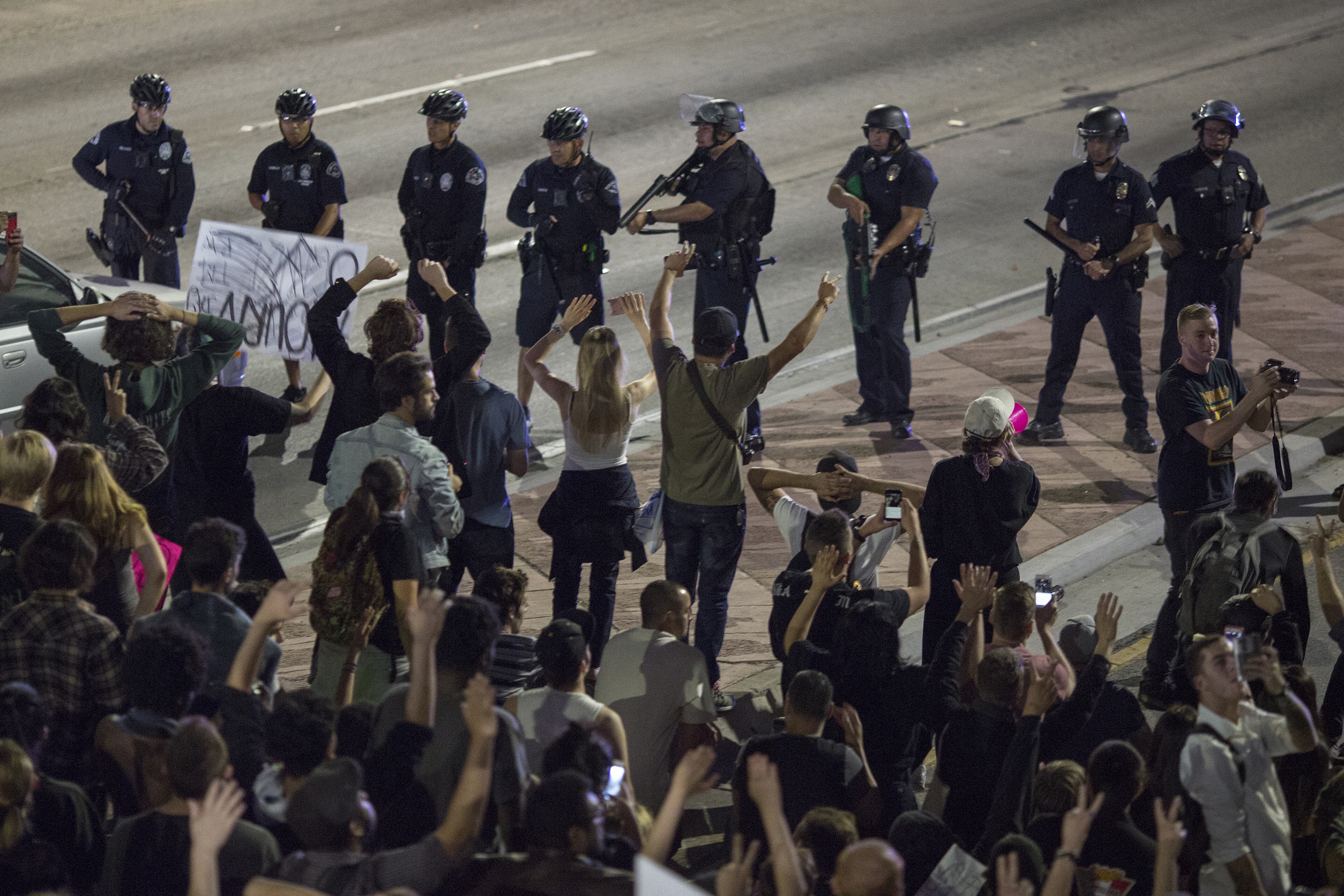 LOS ANGELES, CA - NOVEMBER 09: Police advance on protesters who shut down the 101 freeway in opposition to the upset election of Republican Donald Trump over Democrat Hillary Clinton in the race for President of the United States on November 9 2016 in Los Angeles, California, United States. (Photo by David McNew/Getty Images)