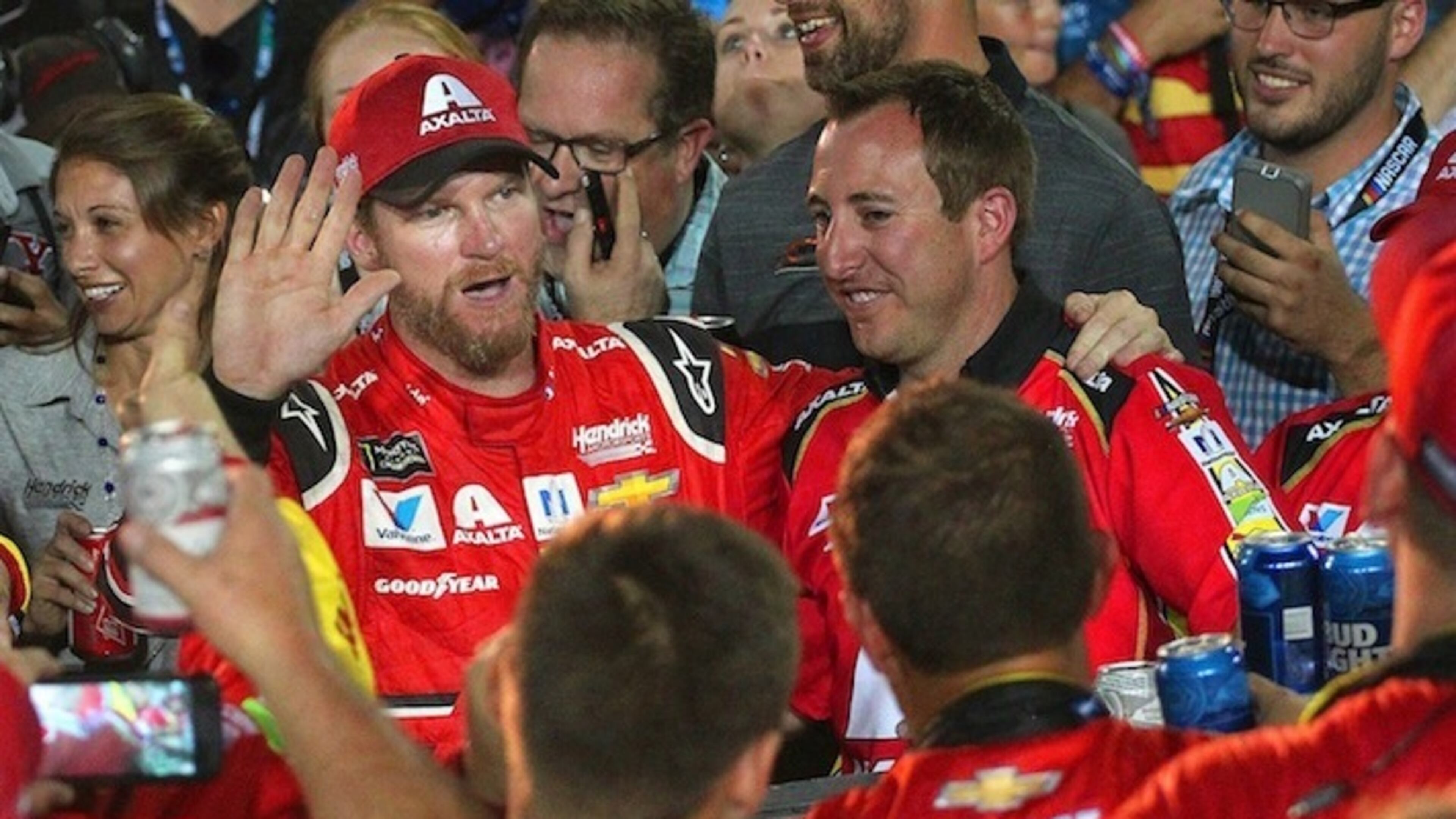 Dale Earnhardt Jr. toasts with beers with his pit crew as he ended his NASCAR career following the Ford EcoBoost 400 on Sunday, Nov. 19, 2017 at the Homestead-Miami Speedway in Homestead, Fla. Earnhardt Jr. also waved to many of his fans as they bid him farewell. (Carl Juste/Miami Herald/TNS)