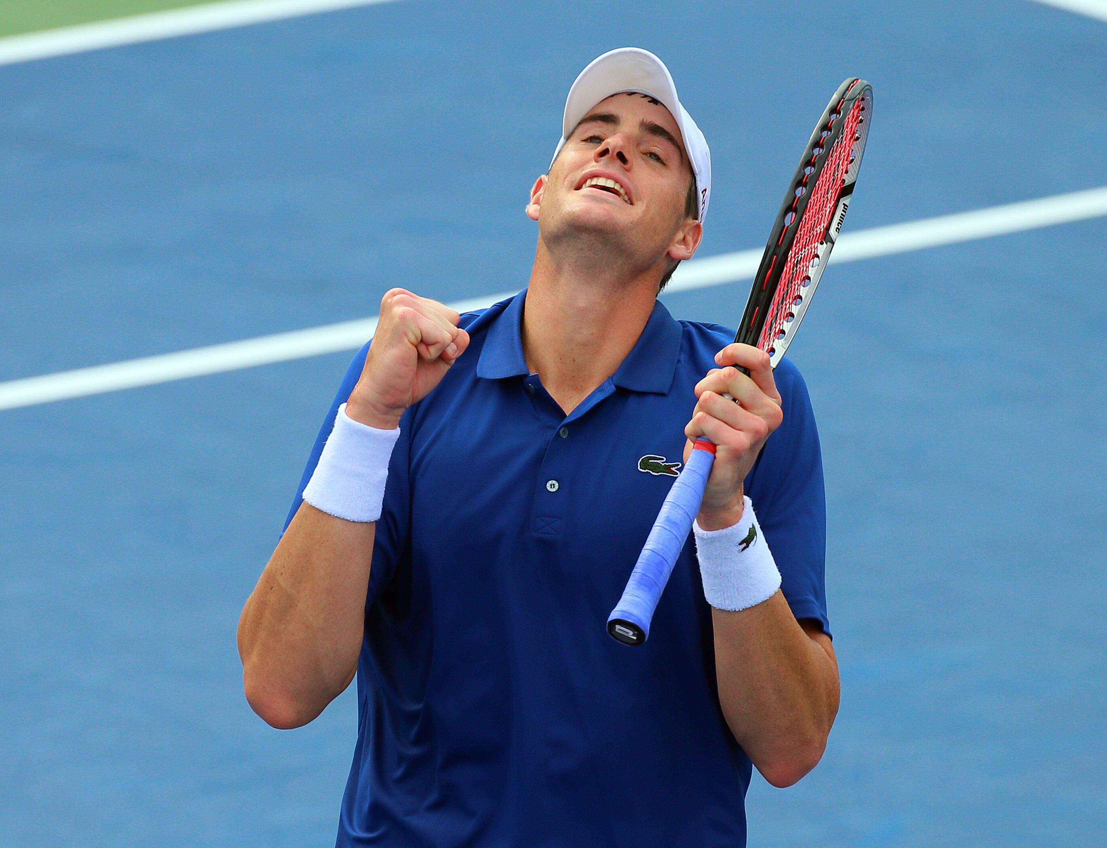 John Isner reacts to defeating Lleyton Hewitt 6-4, 4-6, 7-6 (5) to win their semi-finals match and advance to the final at the BB&T Atlanta Open on Saturday, July 27, 2013, in Atlanta. CURTIS COMPTON / CCOMPTON@AJC.COM