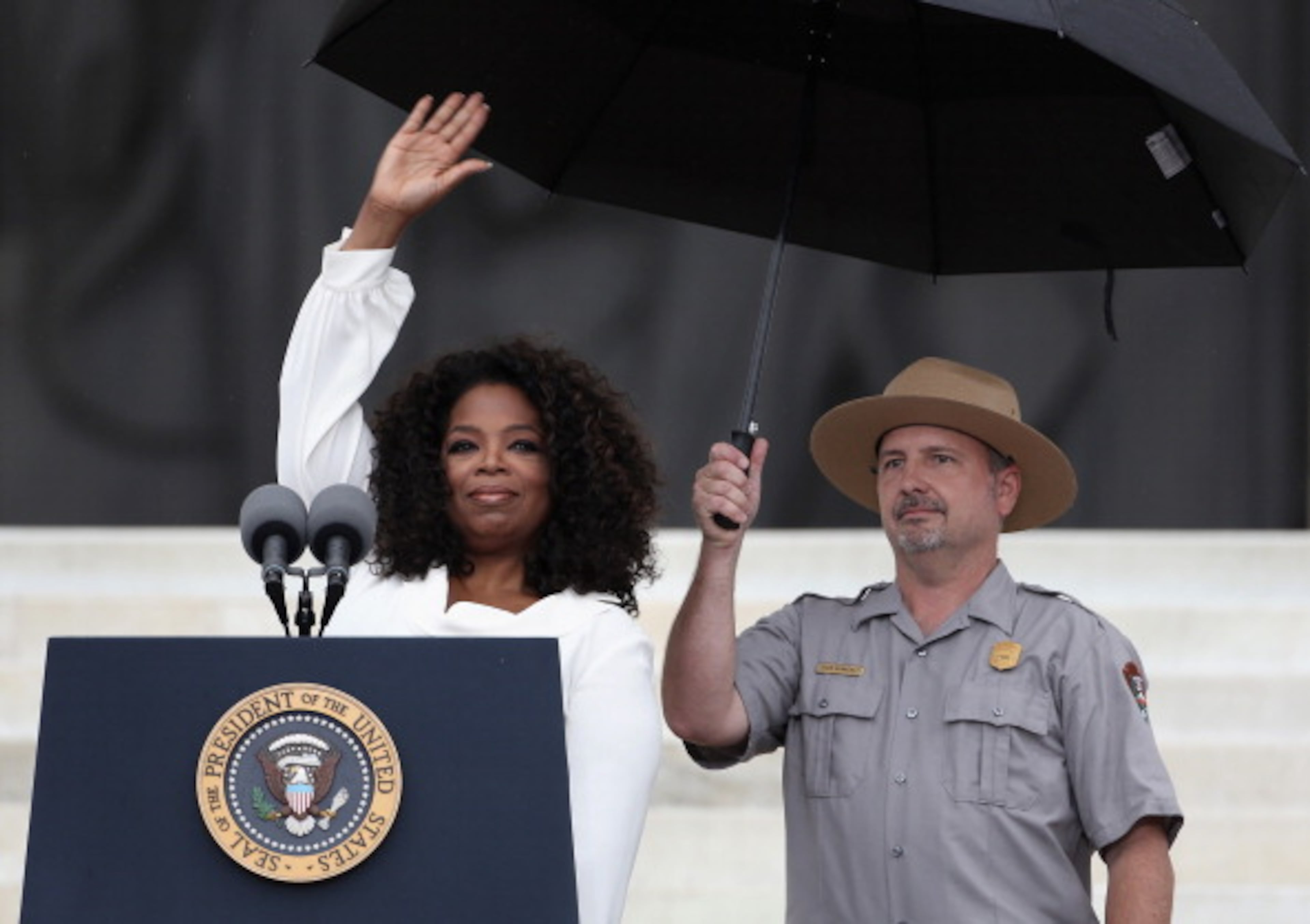 WASHINGTON, DC - AUGUST 28: Talk show host Oprah Winfrey (L) speaks during the Let Freedom Ring ceremony at the Lincoln Memorial August 28, 2013 in Washington, DC. The event was to commemorate the 50th anniversary of Dr. Martin Luther King Jr.'s "I Have a Dream" speech and the March on Washington for Jobs and Freedom. (Photo by Alex Wong/Getty Images)