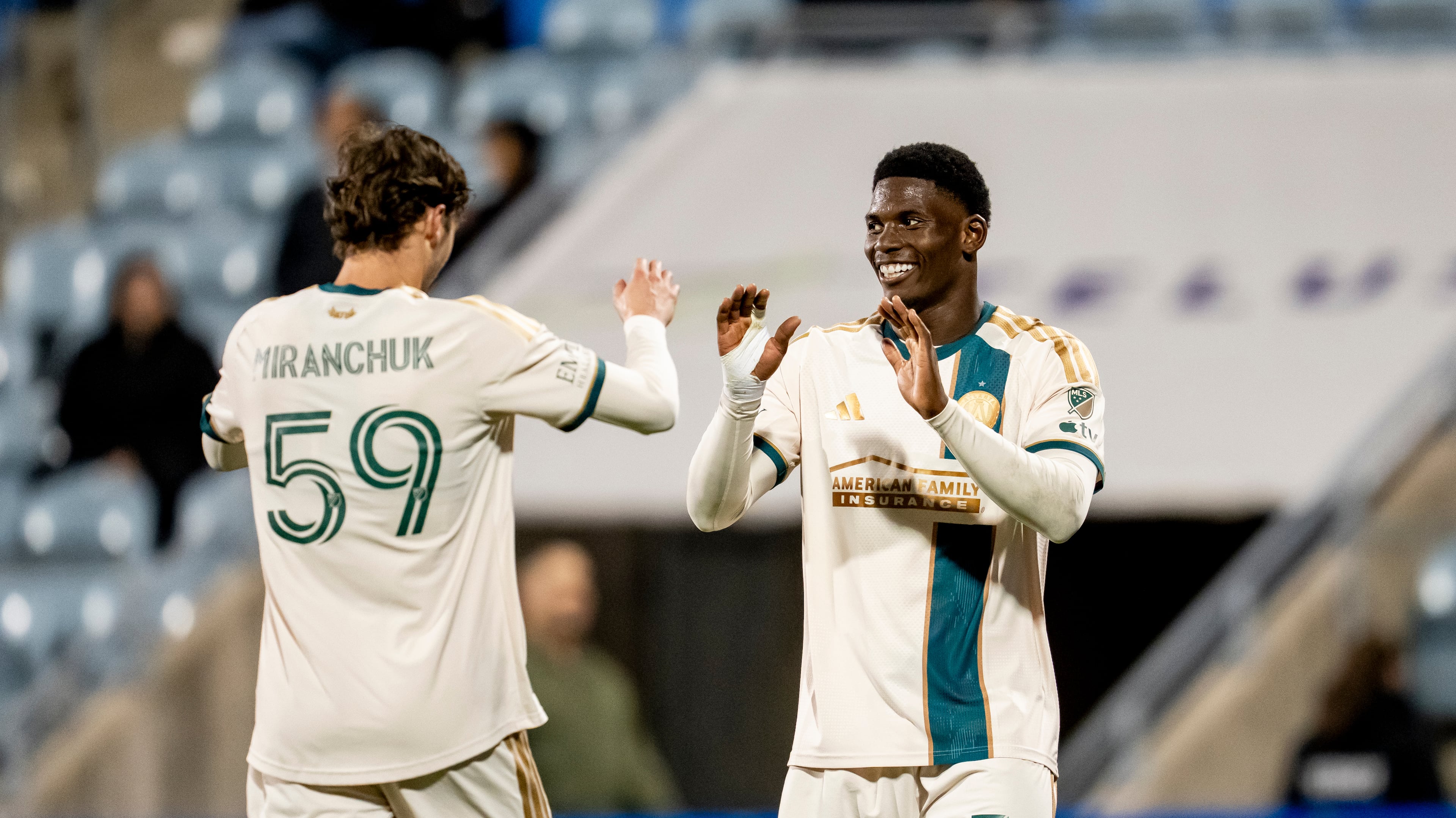 Atlanta United's Breel Embolo (right) celebrates his goal against CF Montreal with teammate Alexey Miranchuk (left) during the second half of a MLS soccer game in Montreal, Wednesday, Oct. 14, 2026. (Christopher Katsarov/The Canadian Press via AP)