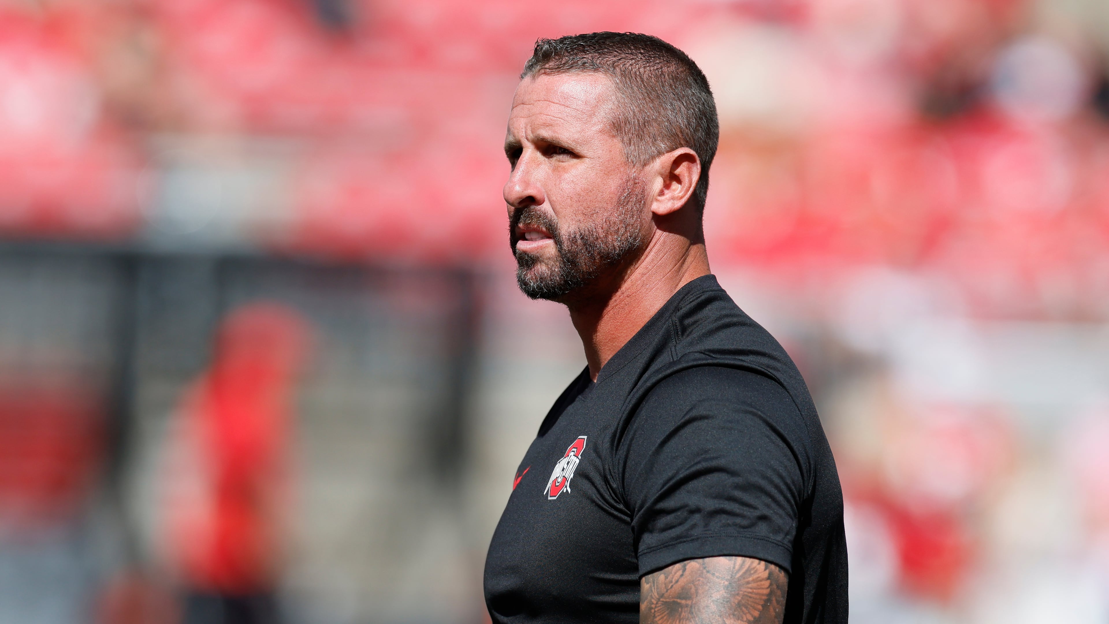 FILE - Ohio State offensive coordinator and wide receivers coach Brian Hartline stands on the field before the start of their NCAA college football game against Texas, Aug. 30, 2025, in Columbus, Ohio. (AP Photo/Jay LaPrete, File)