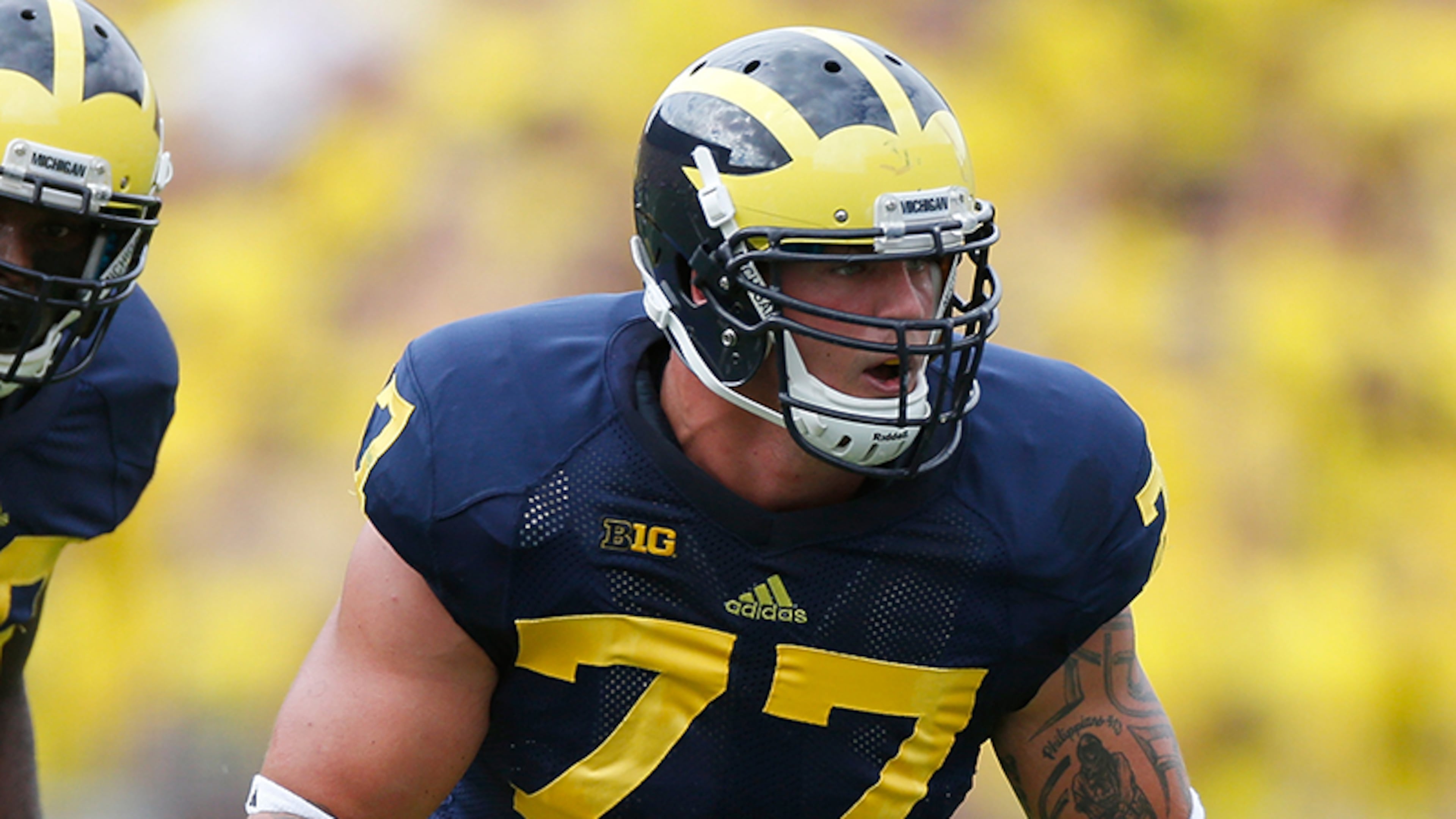 ANN ARBOR, MI - AUGUST 31: Taylor Lewan #77 of the Michigan Wolverines lines up with Louis Palmer #56 of the Central Michigan Chippewas during the first quarter at Michigan Stadium on August 31, 2013 in Ann Arbor, Michigan. (Photo by Gregory Shamus/Getty Images) ANN ARBOR, MI - AUGUST 31: Taylor Lewan #77 of the Michigan Wolverines lines up with Louis Palmer #56 of the Central Michigan Chippewas during the first quarter at Michigan Stadium on August 31, 2013 in Ann Arbor, Michigan. (Photo by Gregory Shamus/Getty Images)