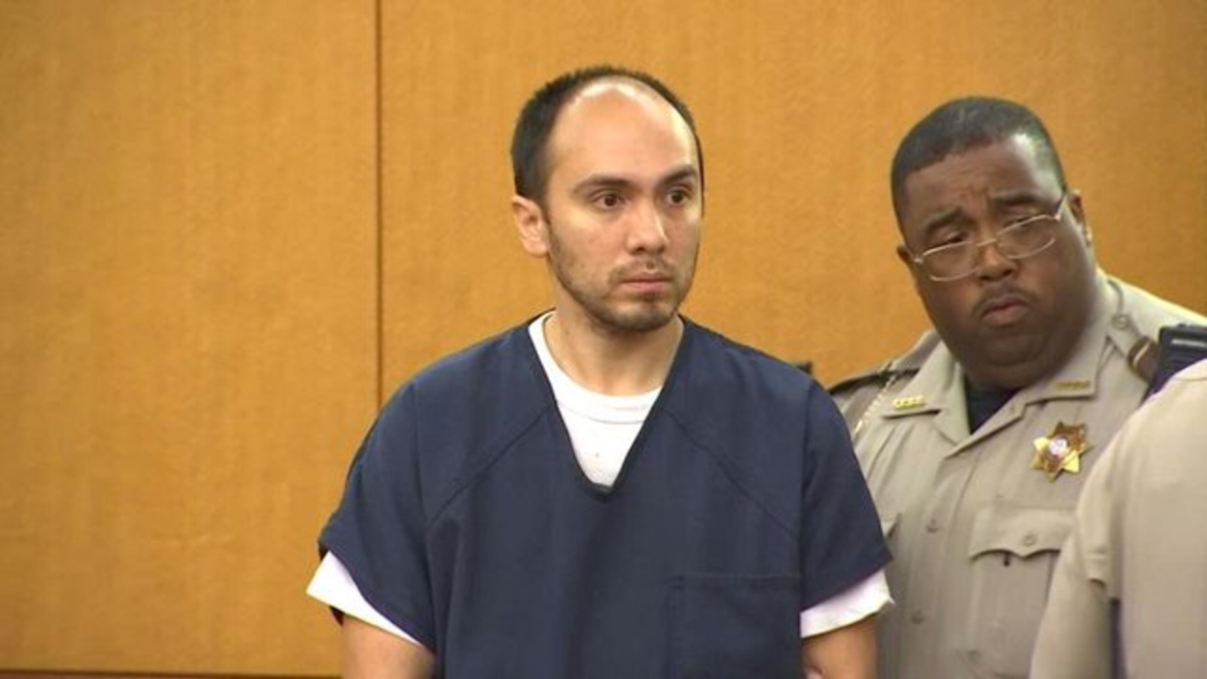 Michael Morgan is escorted into a Fulton County courtroom on Friday, May 26.