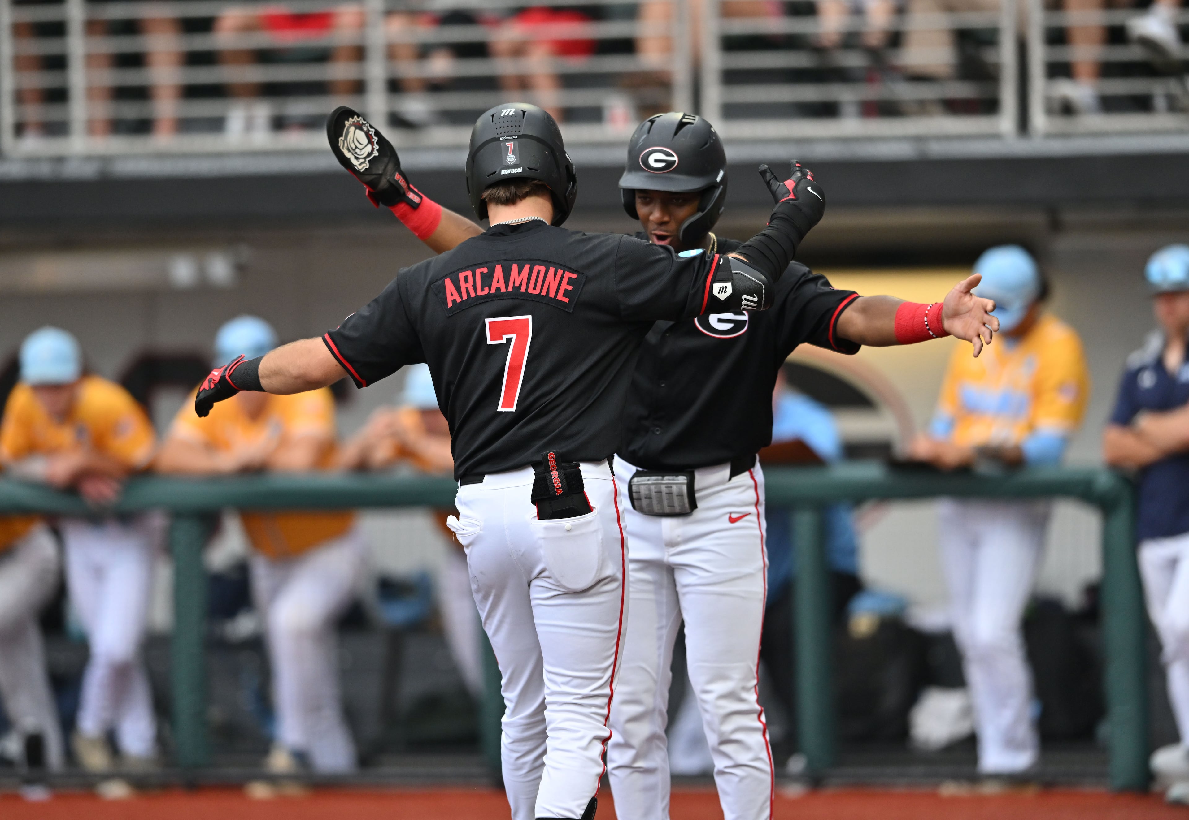 Georgia catcher Jack Arcamone (7) celebrates with Georgia infielder Ryan Wynn (0) after hitting a 2-run home run during the third inning of their NCAA Regional game at Foley Field, Friday, May 29, 2026, in Athens. (Hyosub Shin/AJC)