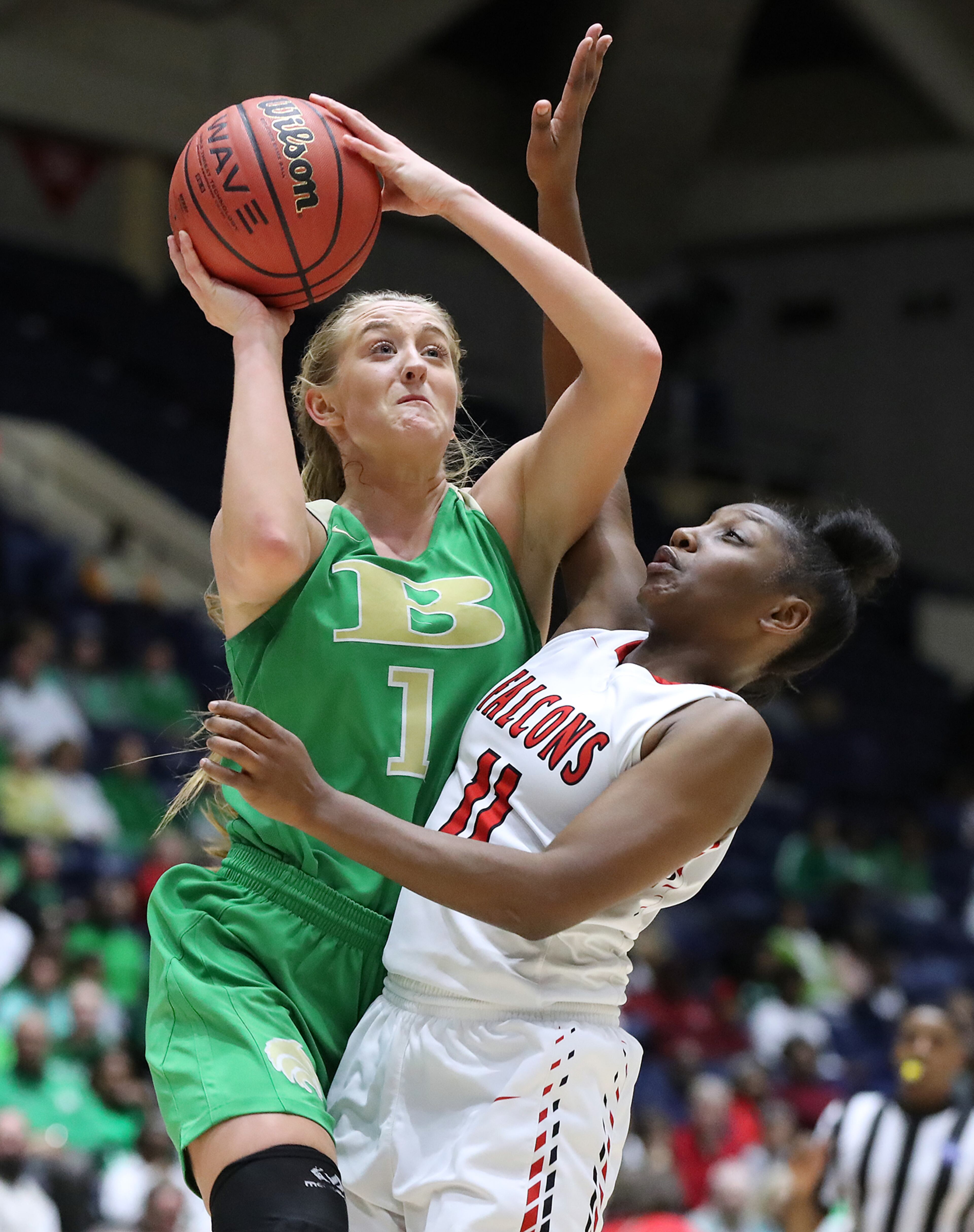 March 8, 2018 Macon: Buford guard Tory Ozment shoots for two over Flowery Branch guard Ashley Woodroffe and draws a foul in their GHSA state basketball championship game on Thursday, March 8, 2018, in Macon. Curtis Compton/ccompton@ajc.com