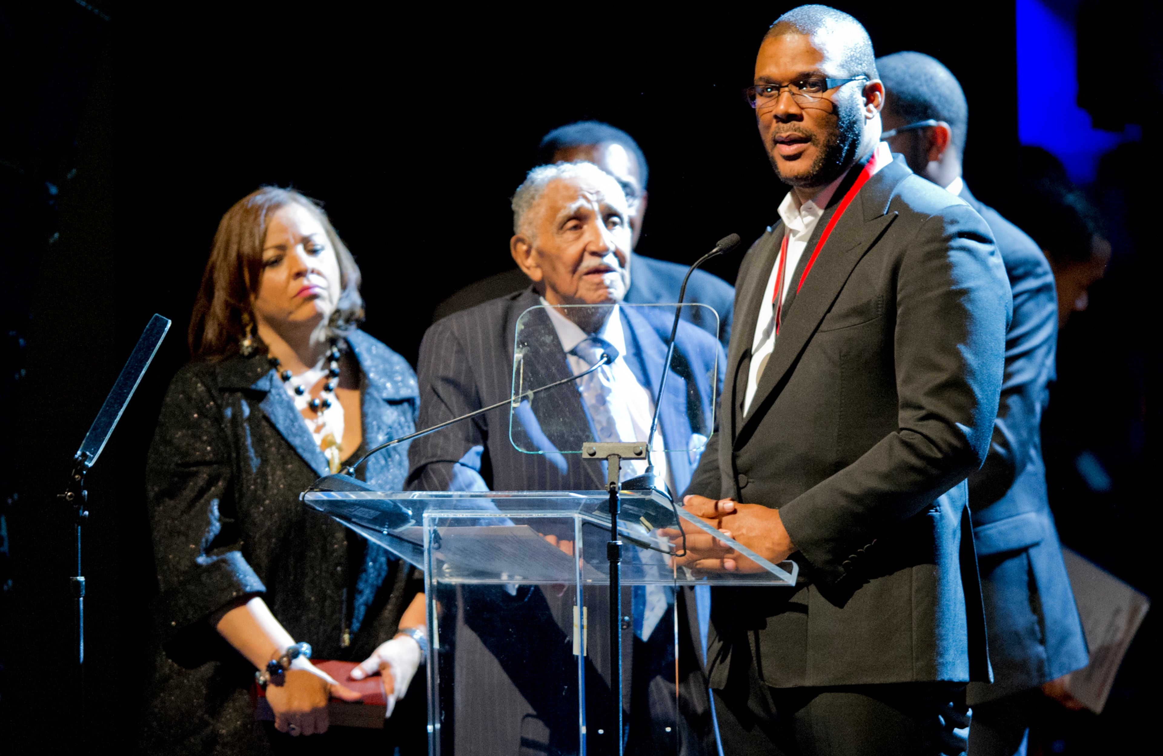 Lowery (middle) looks on as Tyler Perry (right) accepts the inaugural Joseph E. Lowery Agent of Change Award during Lowery's 92nd birthday celebration at Morehouse College in 2013. JONATHAN PHILLIPS / SPECIAL