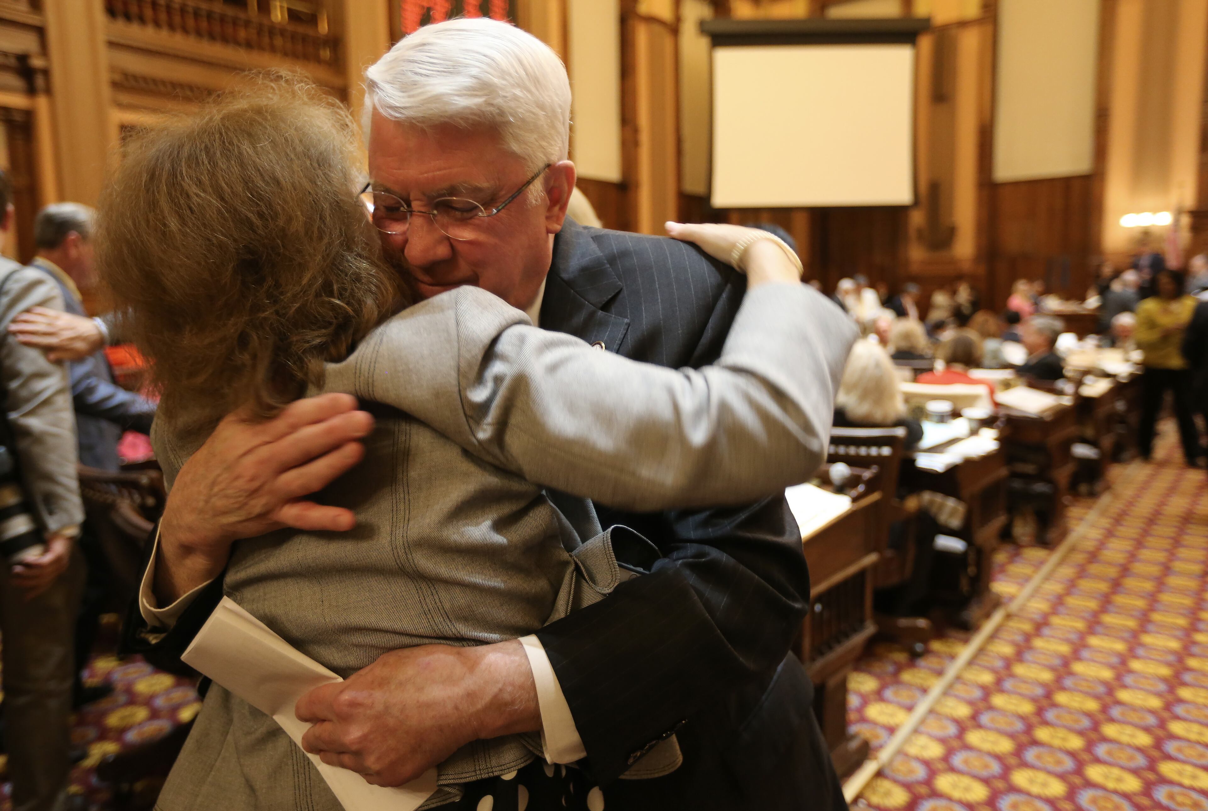 March 24, 2016 Atlanta: Rep. Joe Wilkinson (R-Atlanta) hugs House staff member Debbie Lynn after giving his farewell speech Thursday evening March 24, 2016 during the final day of the 2016 Legislative session. WIlkinson was planning to run for another term, but pulled himself out of the race late Wednesday. Ben Gray / bgray@ajc.com