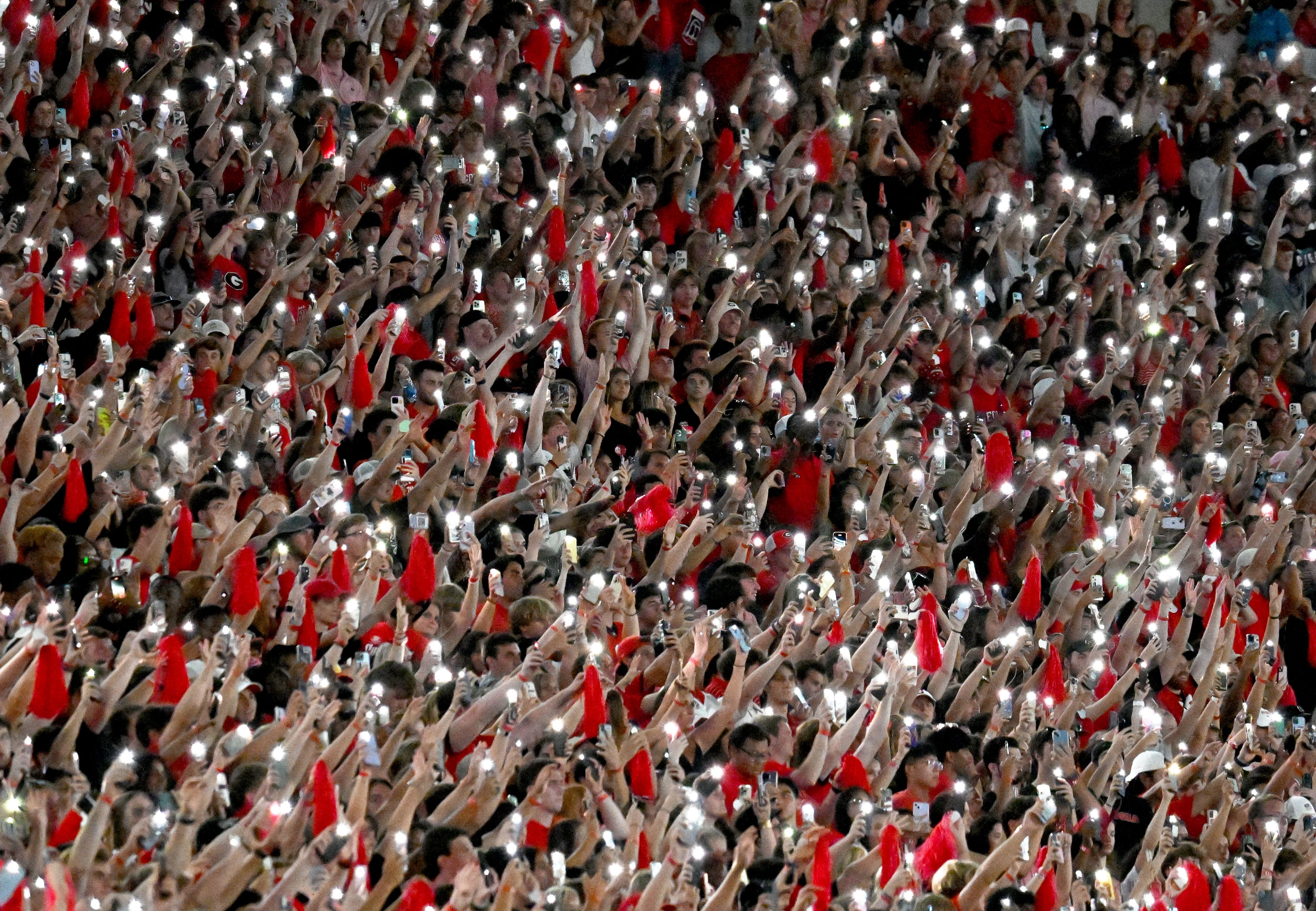 Georgia fans light up the stadium at the start of the fourth quarter in an NCAA football game at Sanford Stadium, Saturday, September 2, 2023, in Athens. Georgia won 48-7 over UT Martin. (Hyosub Shin / Hyosub.Shin@ajc.com)