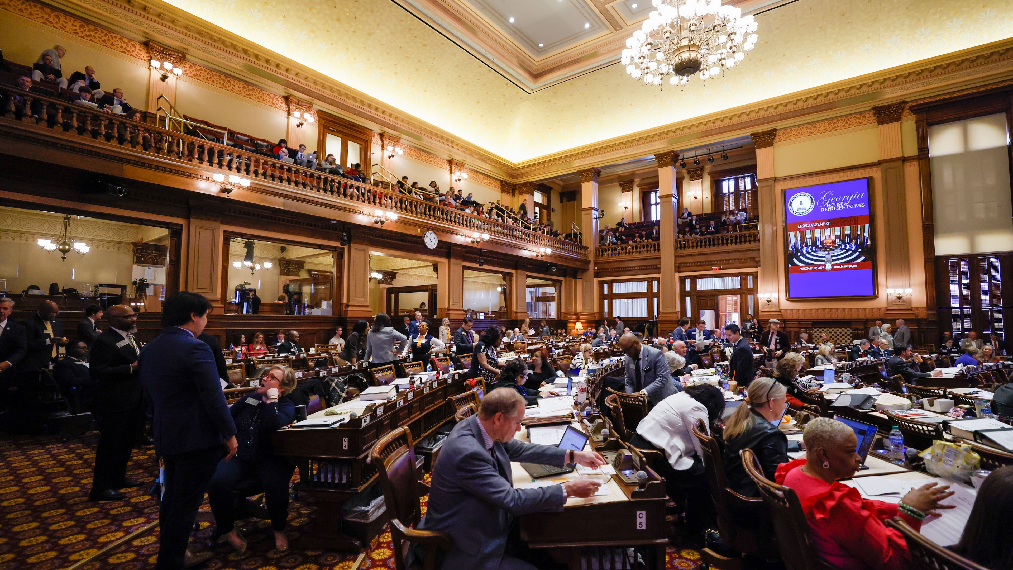 House Chamber lawmakers gather during Crossover Day at the Capitol in Atlanta on Thursday, Feb. 29, 2024. Thursday is the last day for a bill to move from one chamber to another. (Miguel Martinez / miguel.martinezjimenez@ajc.com)