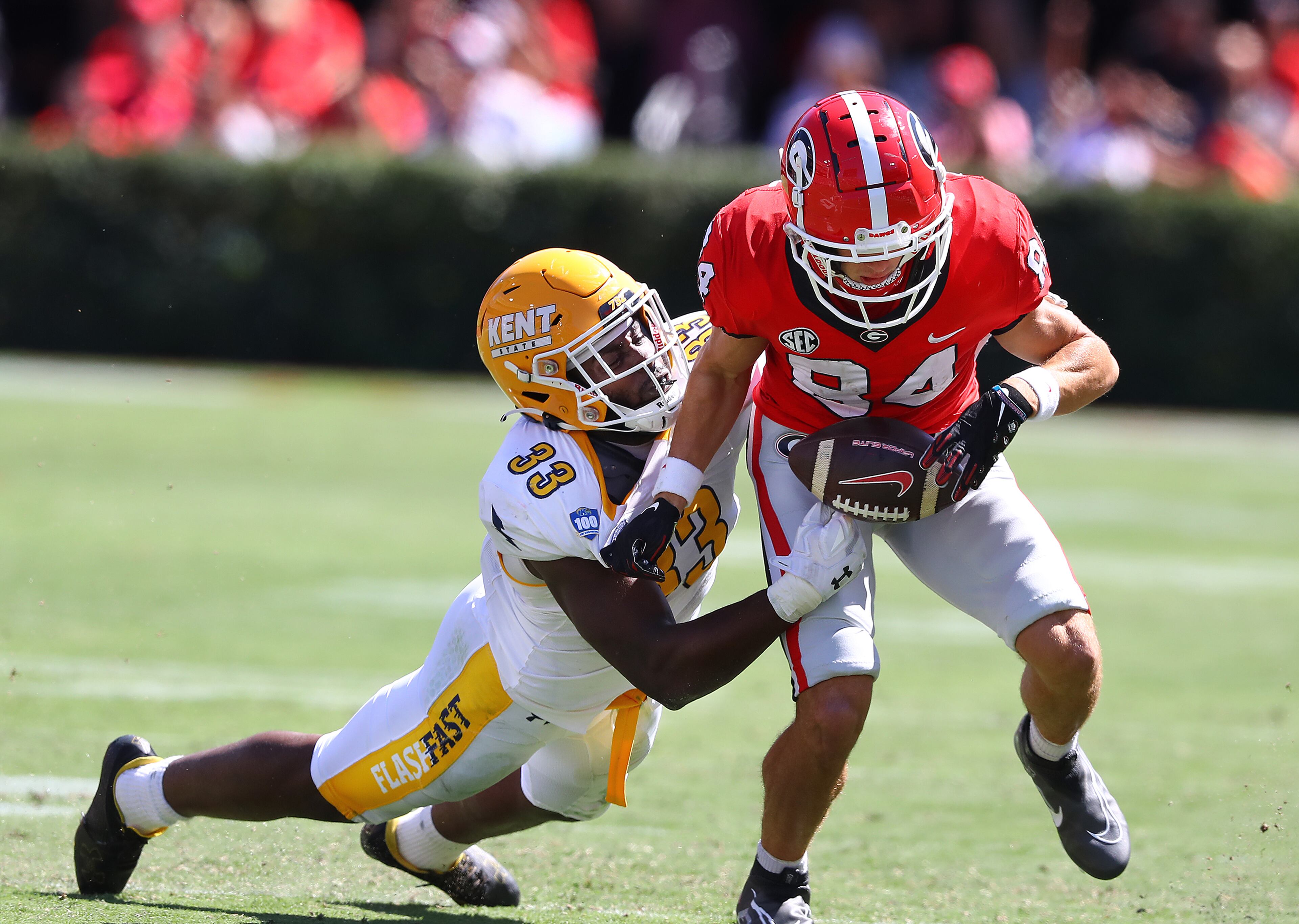Kent State linebacker Marvin Pierre strips Georgia wide receiver Ladd McConkey of the ball for a turnover during the second quarter in a NCAA college football game on Saturday, Sept. 24, 2022, in Athens. “Curtis Compton / Curtis Compton@ajc.com