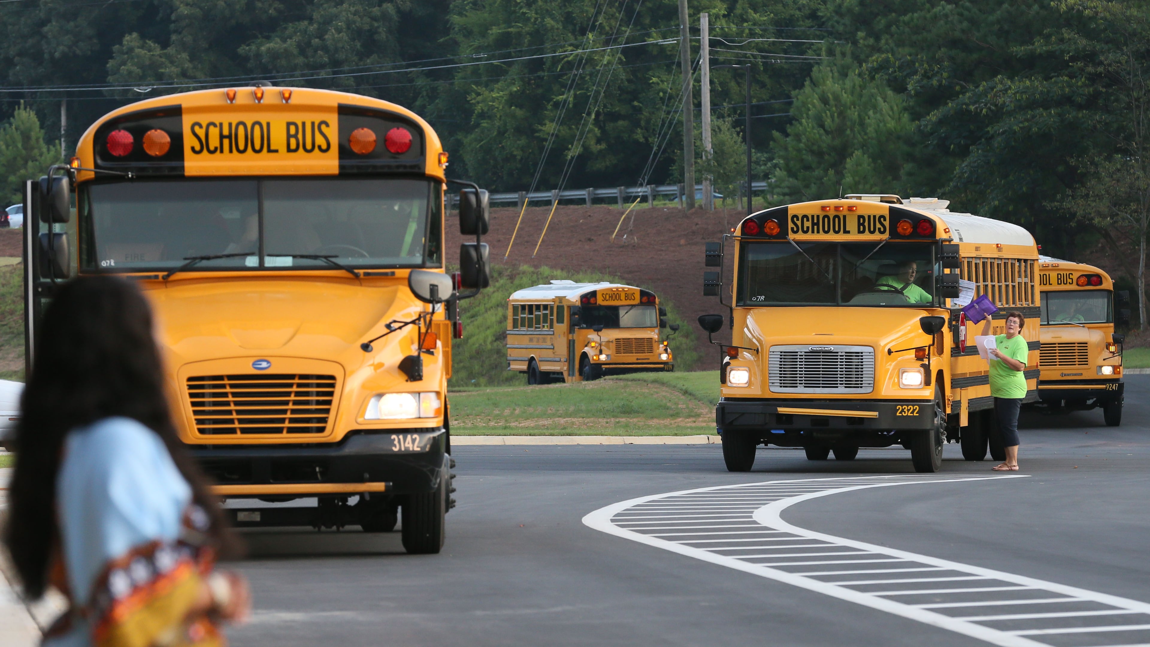 Buses arrive on the first day back at school at Baguette Elementary School in Lawrenceville on Aug. 10, 2015. BOB ANDRES / BANDRES@AJC.COM