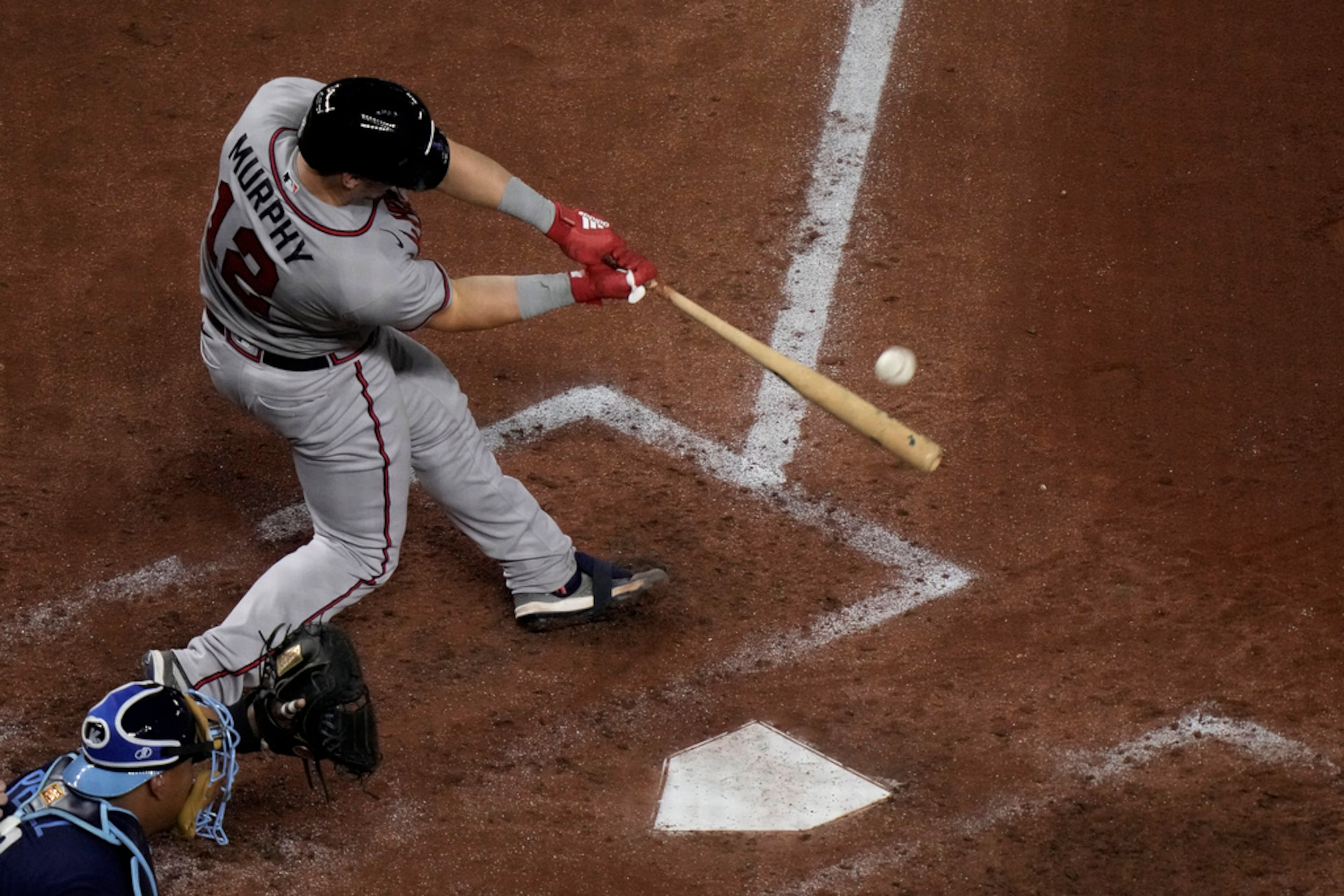Atlanta Braves' Sean Murphy hits a solo home run during the fifth inning of a baseball game against the Kansas City Royals Friday, April 14, 2023, in Kansas City, Mo. (AP Photo/Charlie Riedel)