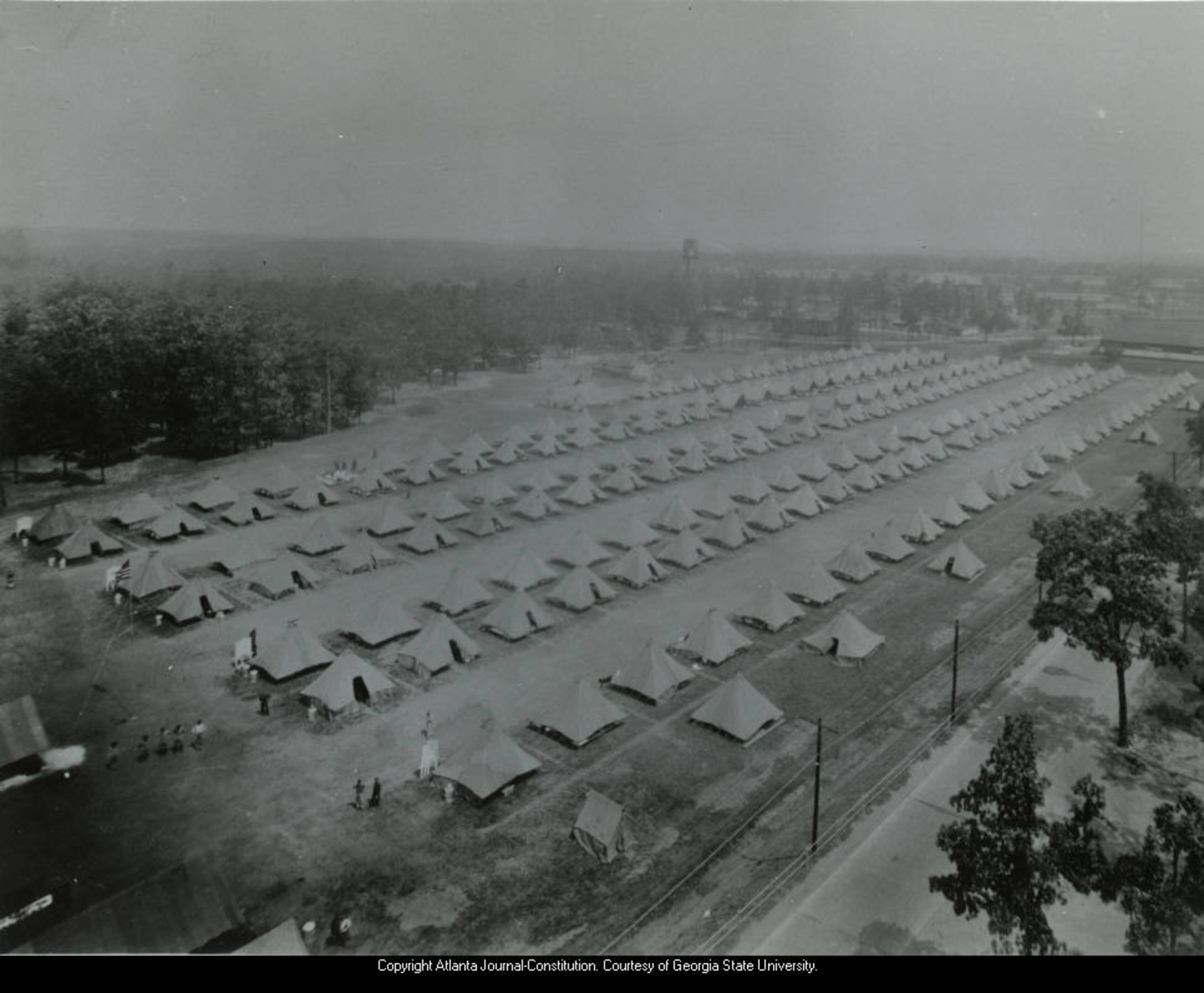 1936 -- This tent city at Fort McPherson housed Civilian Conservation Corps members. The CCC, a public work relief program in operation from 1933-42, gave unemployed, unmarried men aged 18-25 a chance to work at manual labor jobs in rural lands owned by federal, state and local governments as part of the government's efforts to conserve and develop those lands in an effort to reverse the effects of the Dust Bowl and offer some measure of sustenance during the Great Depression.