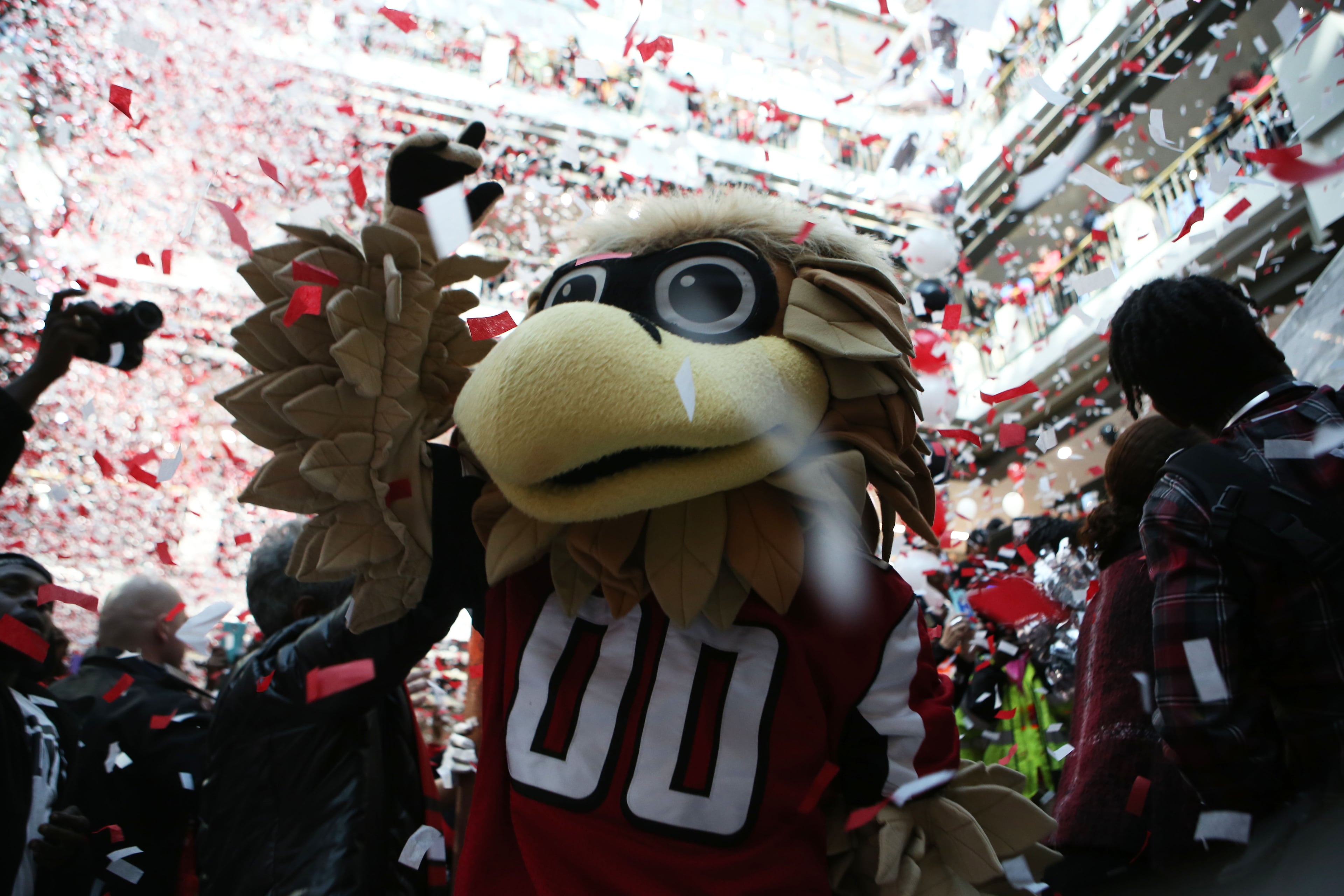 Falcons mascot Freddie Falcon celebrates with a fan at the Atlanta Falcons pep rally held by Mayor Kasim Reed at City Hall in Atlanta on Friday, Jan. 27, 2017. (HENRY TAYLOR / HENRY.TAYLOR@AJC.COM)