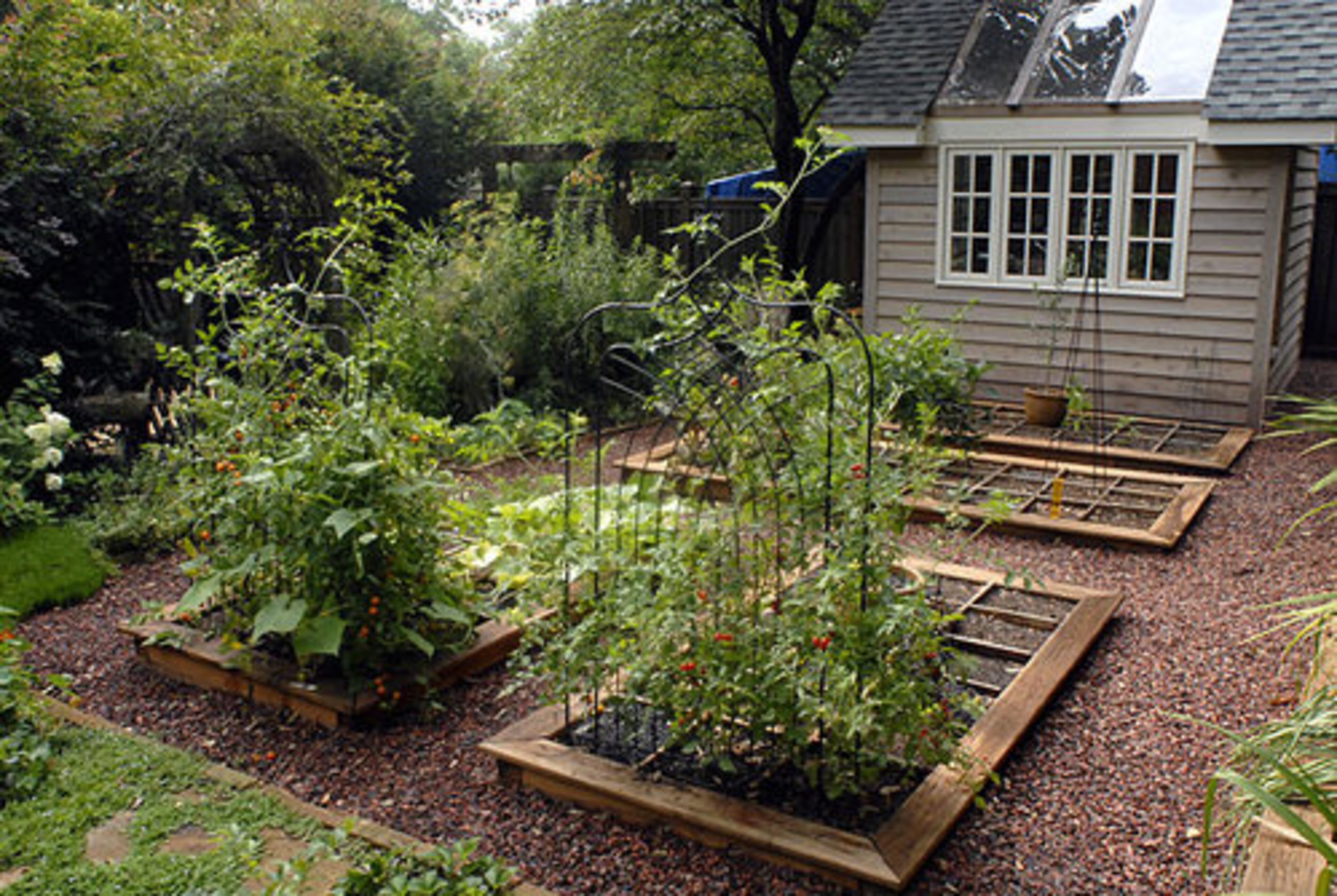 The couple is building this greenhouse to house their tropical plants during the winter. It's among the last projects in their garden.