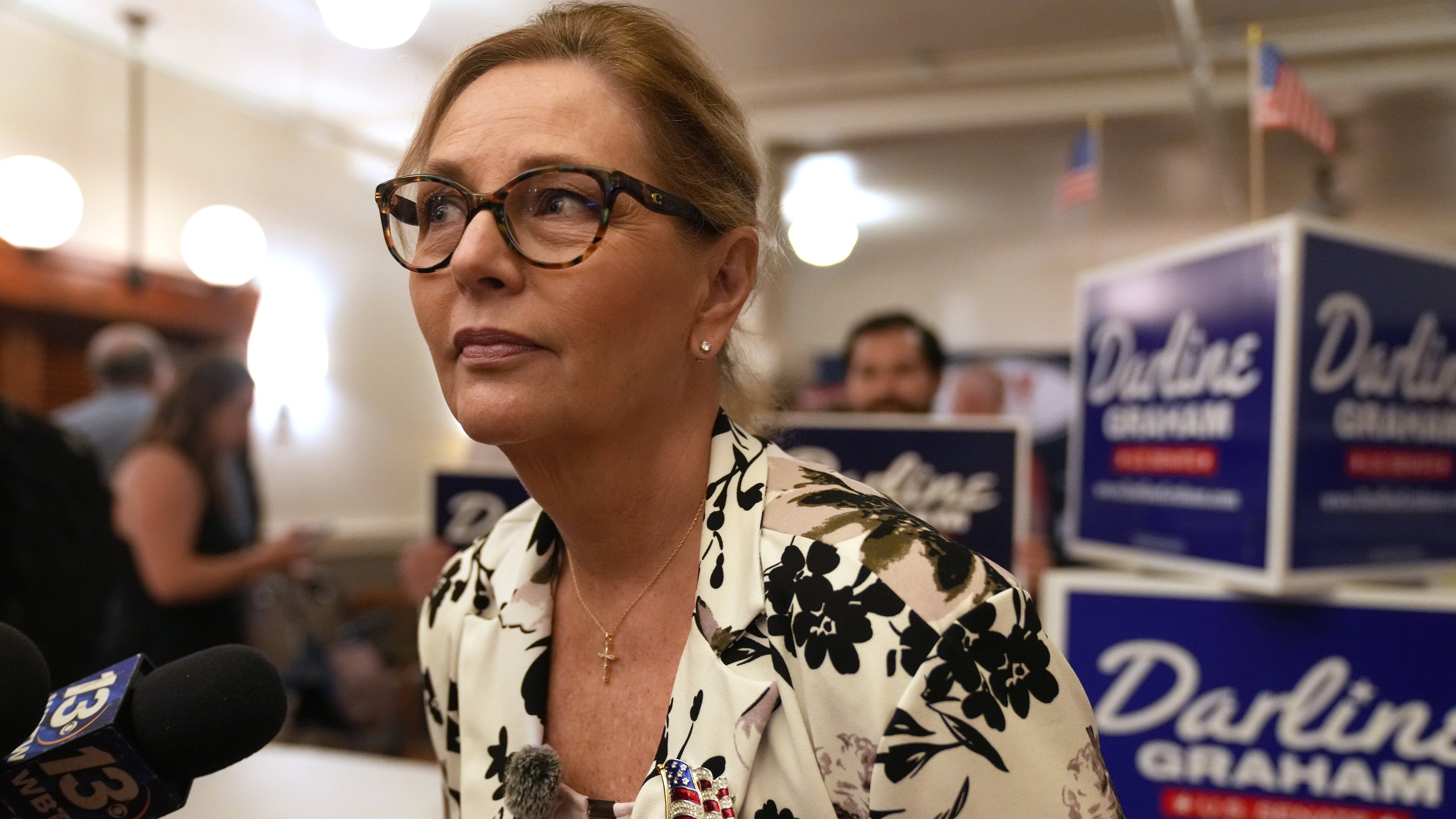 Sen. Darline Graham, R-S.C., leans over to hear a reporter's question following at a candidate event for hopefuls vying in a special Republican primary to replace her late brother Sen. Lindsey Graham, R-S.C., on November ballots, Saturday, Aug. 8, 2026, in Florence, S.C. (AP Photo/Meg Kinnard)